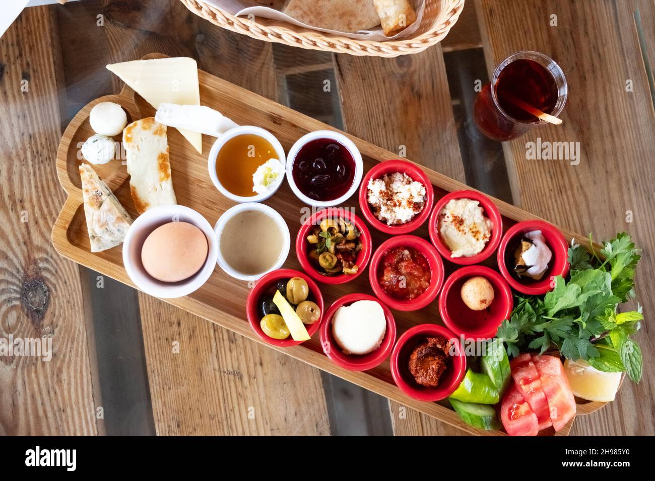 Delicious traditional turkish breakfast with turkish tea on the wooden table. Stock Photo