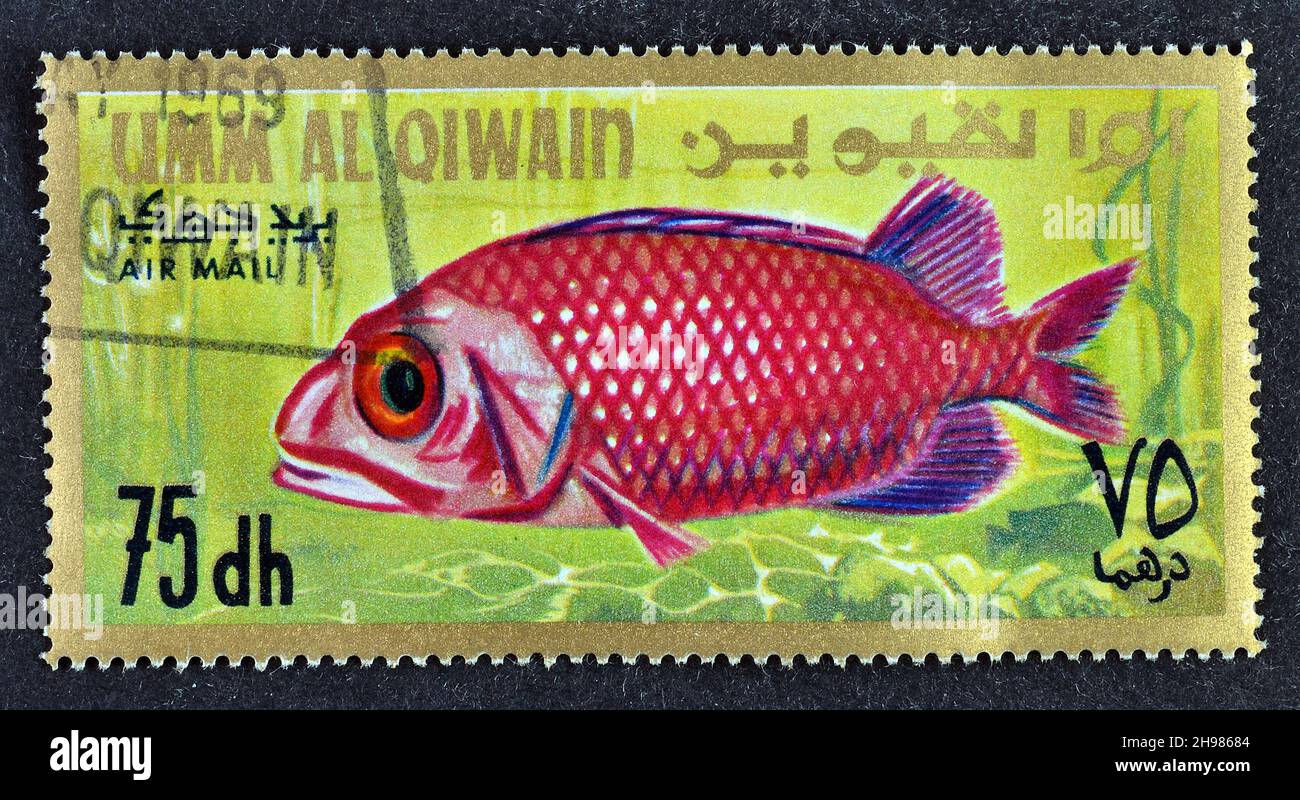 Cancelled postage stamp printed by Emirate of Umm Al Quwain, that shows Japanese Soldierfish (Ostichthys japonicus) - Juvenile, circa 1967. Stock Photo