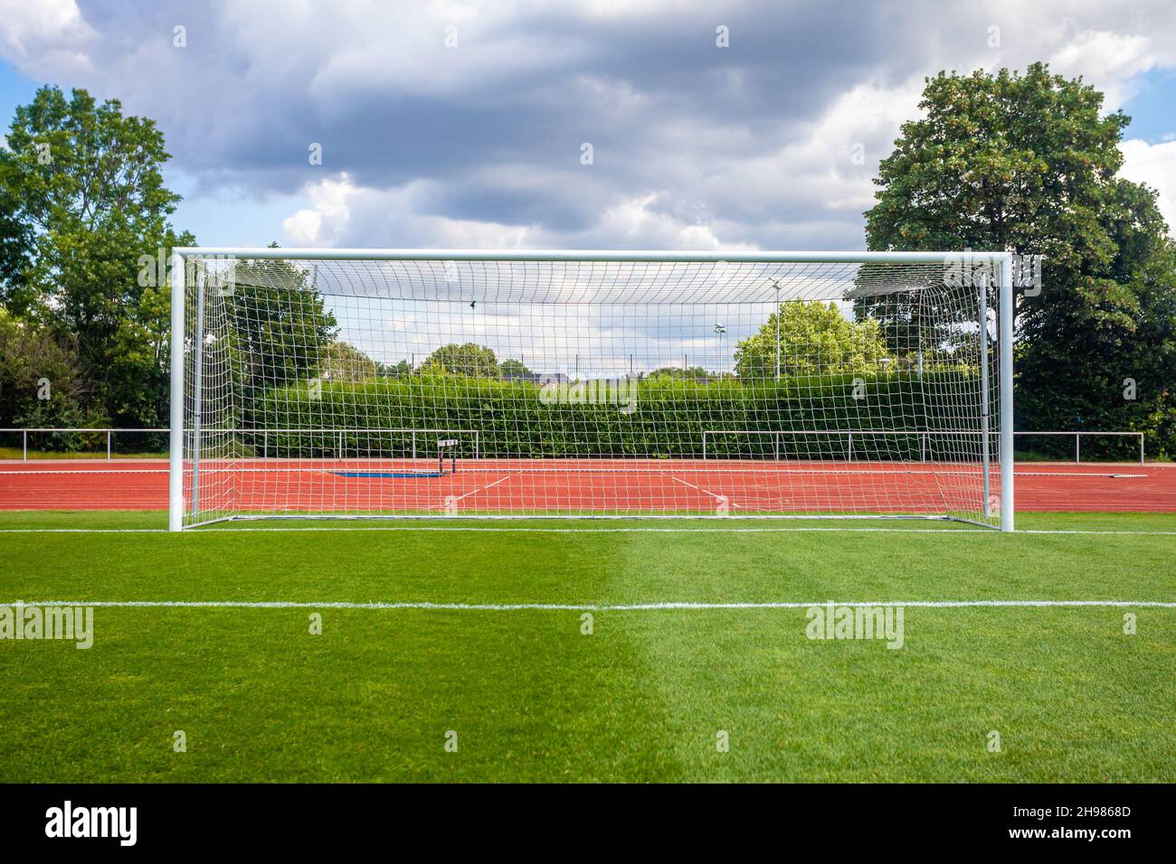 soccer goal on a green lawn on the field Stock Photo