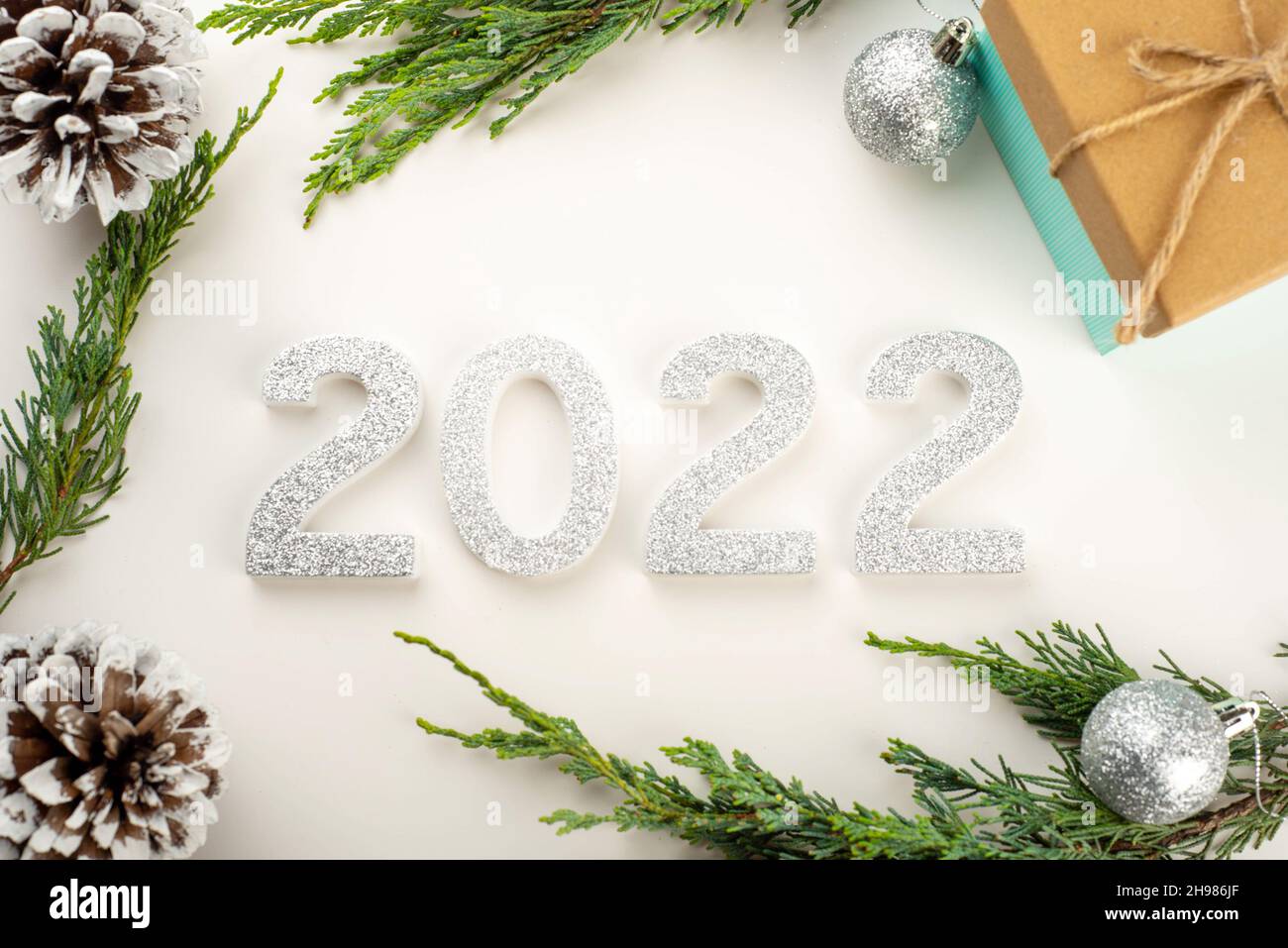 Christmas 2022 Silver 2022 Festive Greeting Background With Pine Cones, Silver Baubles, Christmas  Tree Branches Stock Photo - Alamy