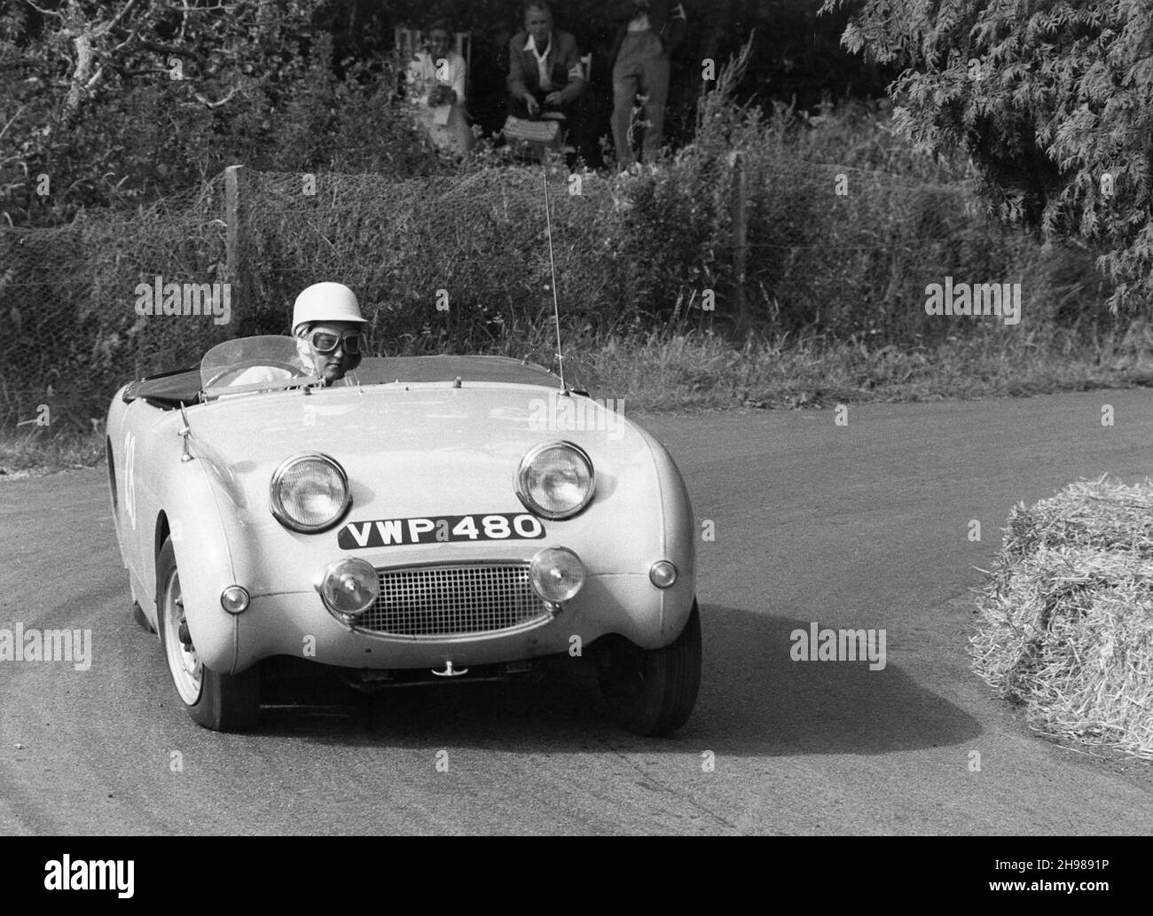 C Wells driving an Austin Healey Frogeye Sprite at the Wiscombe Park Hill, Climb, Devon, 1961. Stock Photo
