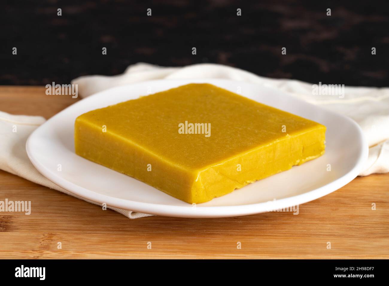Almond halva. Halva on wooden background. Turkish halvah for Breakfast