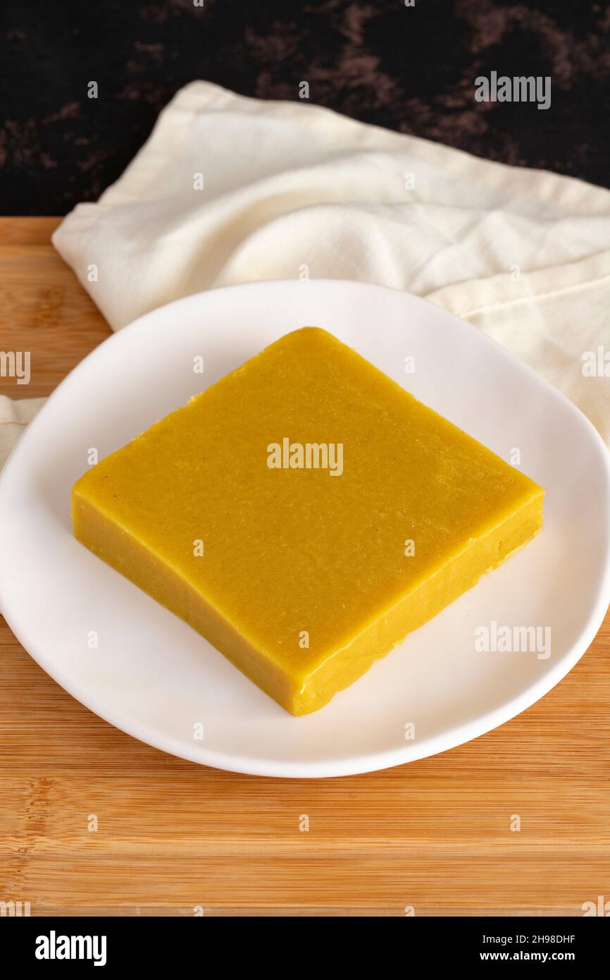 Almond halva. Halva on wooden background. Turkish halvah for Breakfast