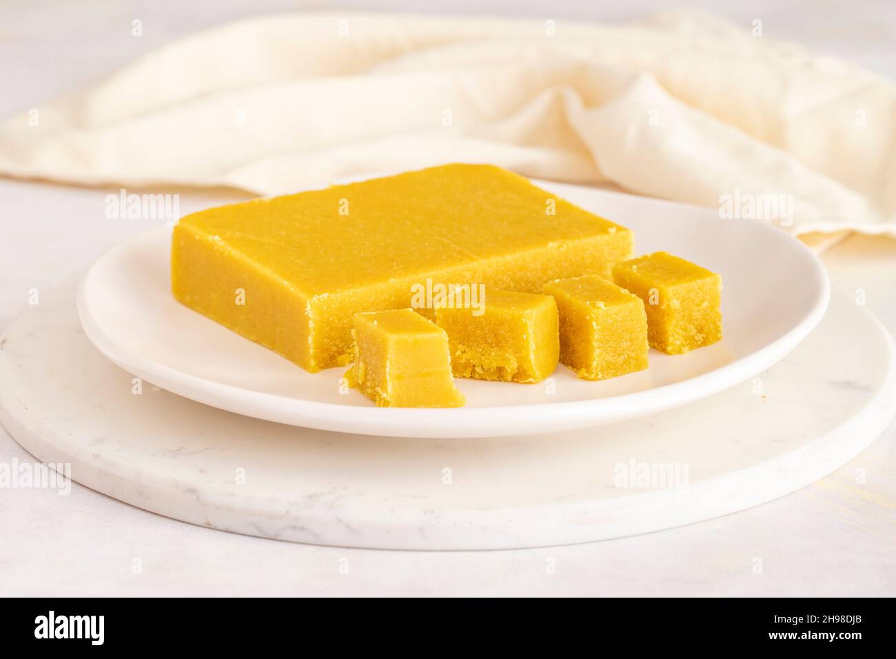 Almond halva. Halva on wooden background. Turkish halvah for Breakfast