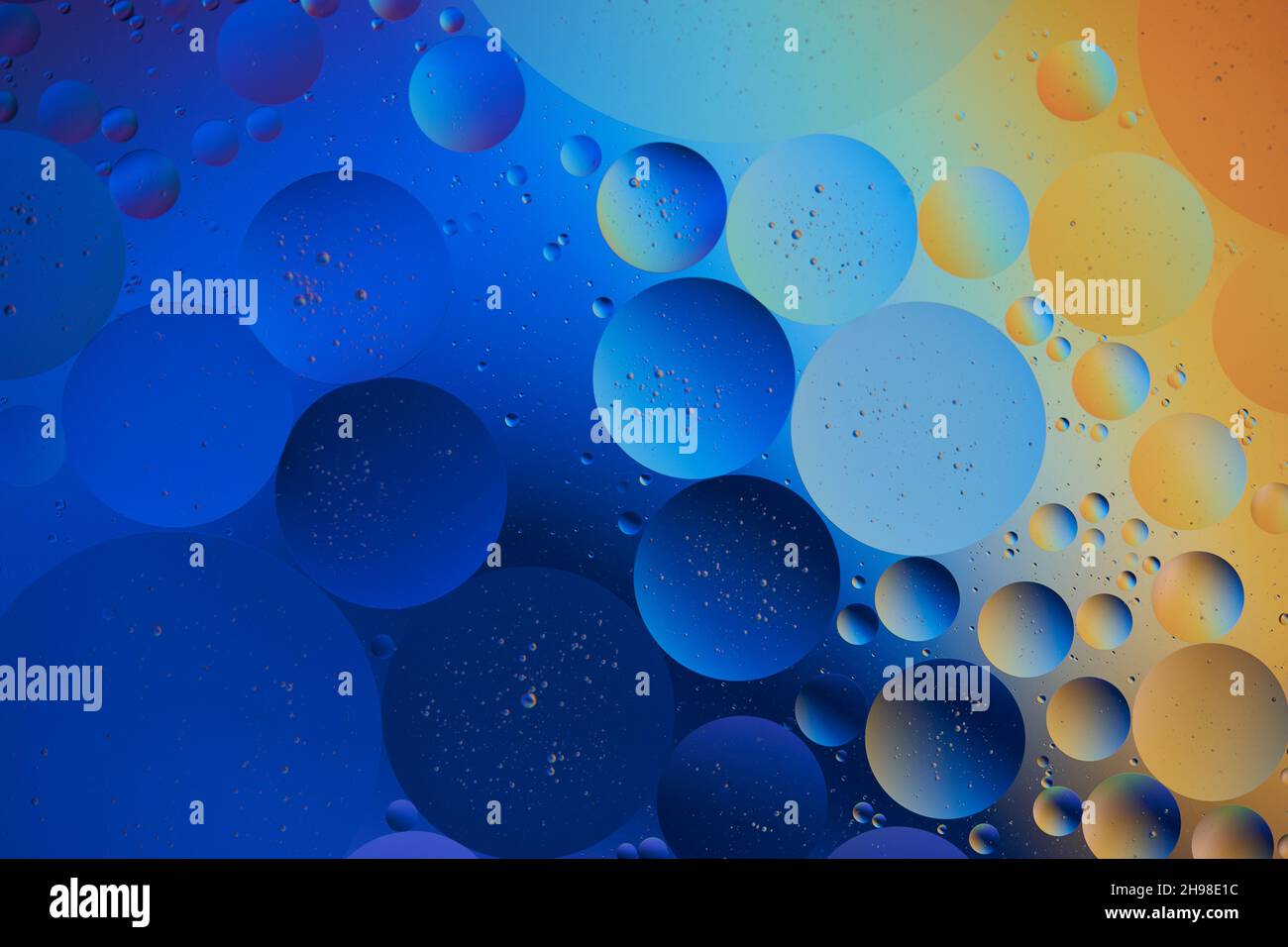 Abstract Background with blue and orange Bubbles in Water. Macro photography. Top view. Stock Photo
