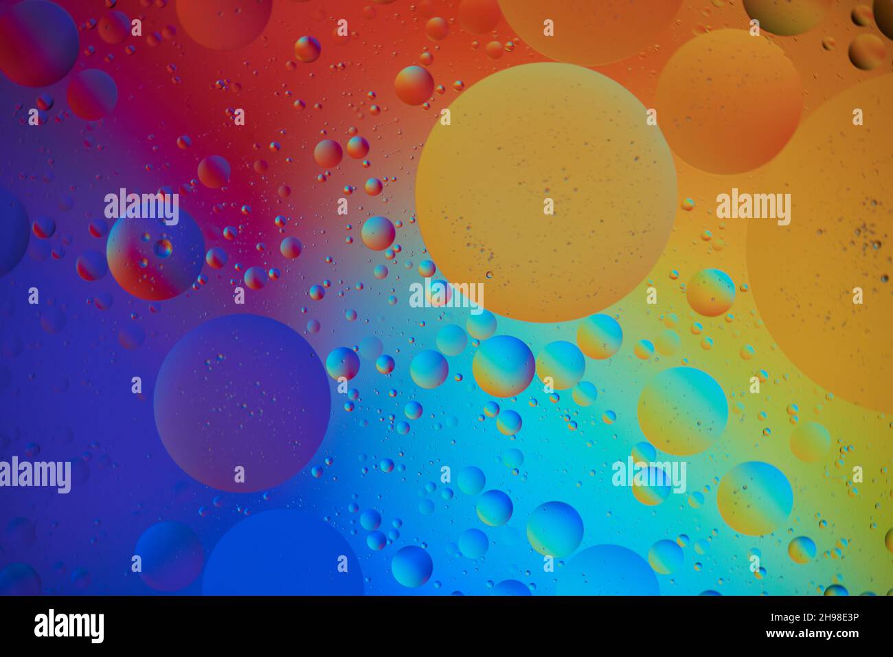 Abstract Background with orange and blue Bubbles in Water. Macro photography. Top view. Stock Photo