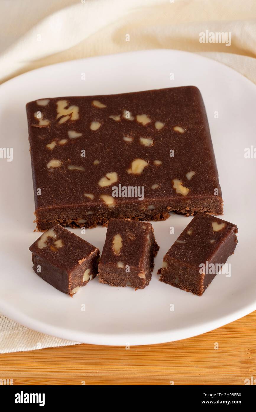 Walnut halva. Halva on wooden background. Turkish halvah for Turkish