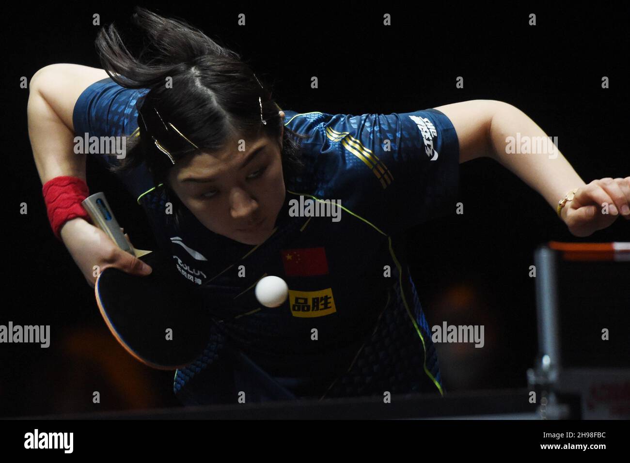 Singapore. 5th Dec, 2021. Chen Meng of China serves during the women's