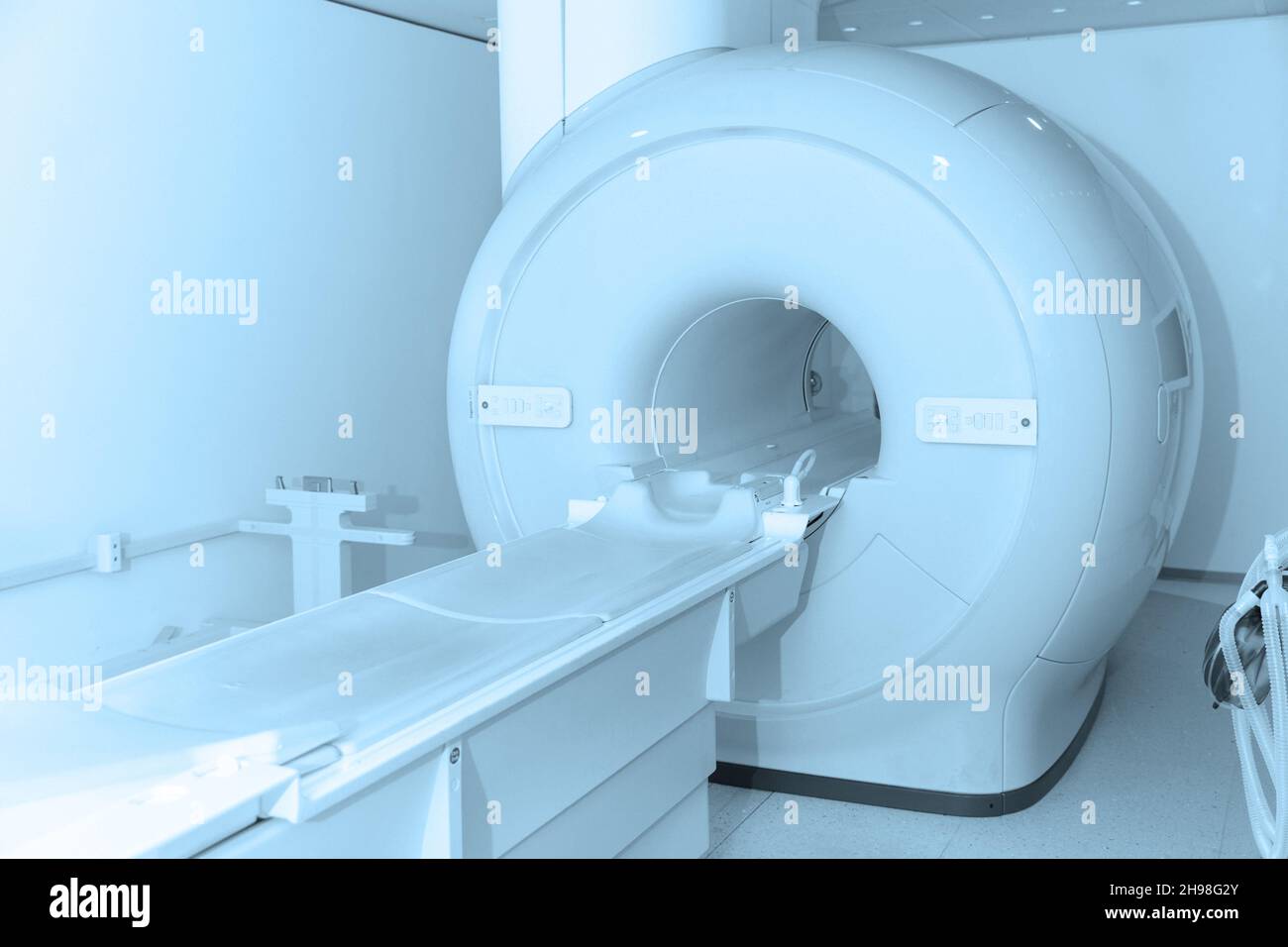 Medical CT or MRI Scan in the modern hospital laboratory. Interior of radiography department. Technologically advanced equipment in white room Stock Photo