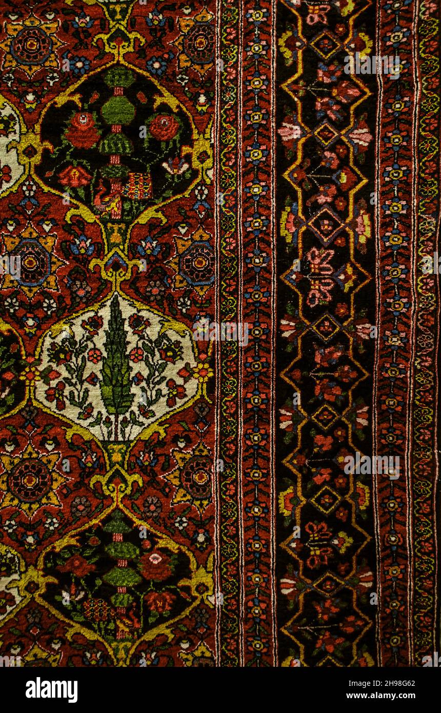 An edge with a patterned border on an ancient Persian carpet in the