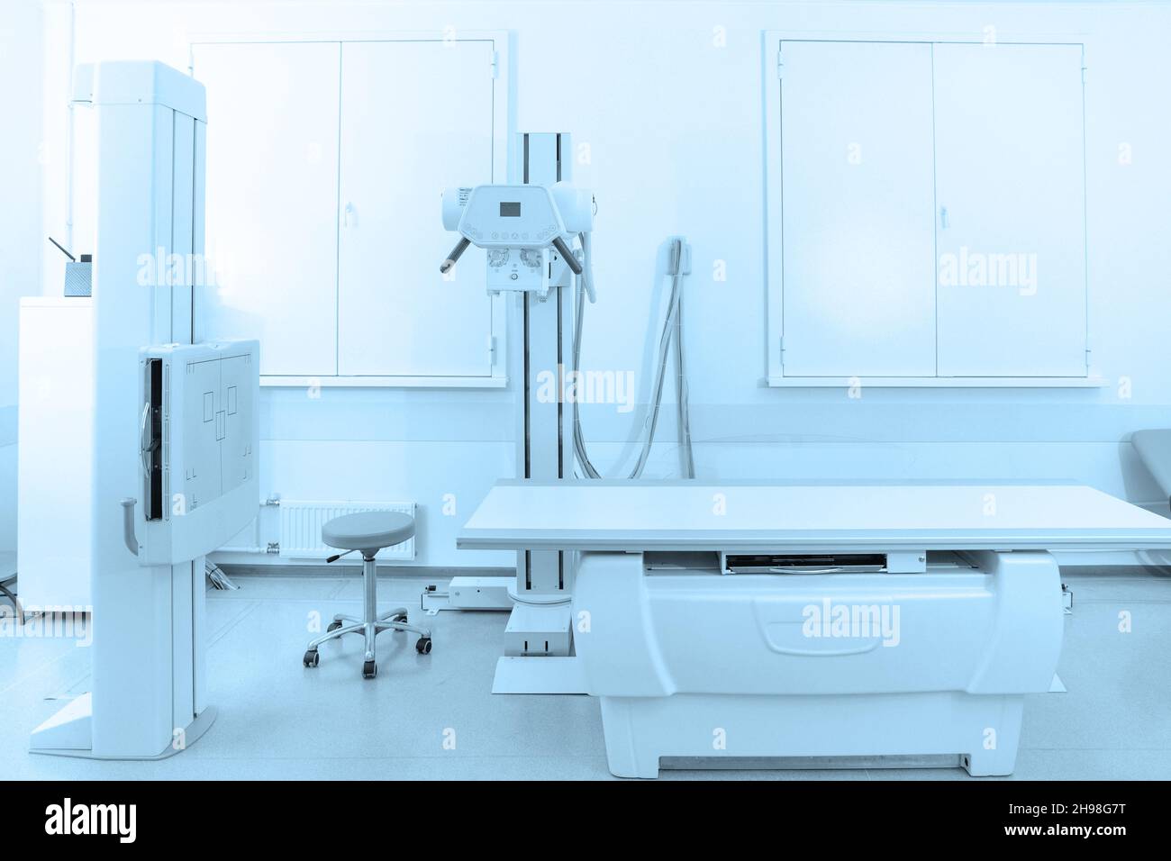 Xray department in modern hospital. Radiology room with scan machine