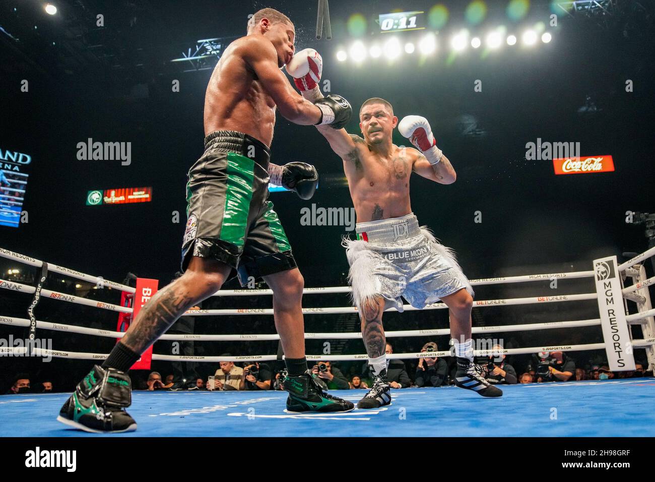 December 4, 2021, Las Vegas, LAS VEGAS, NV, United States: LAS VEGAS, NV - DECEMBER 4: (R-L) Joseph ''Jojo'' Diaz Jr punches Devin Haney during their WBC lightweight title fight at the MGM Grand Garden Arena on December 4, 2021 in Las Vegas, United States. (Credit Image: © Louis Grasse/PX Imagens via ZUMA Press Wire) Stock Photo