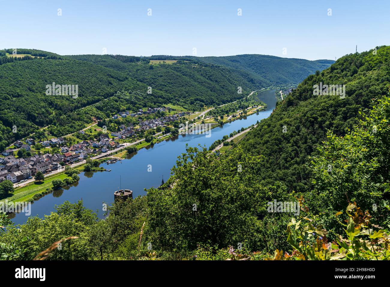 Lasserg, Rhineland-Palatine, Germany - June 14, 2021: View at the River Moselle and the town of Burgen Stock Photo