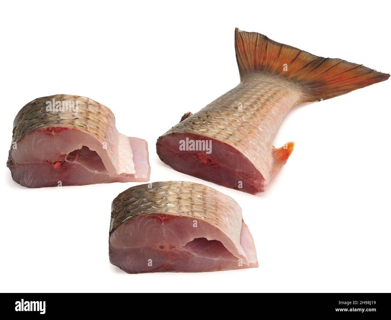 Pieces of red-finned mullet isolated on a white background Stock Photo