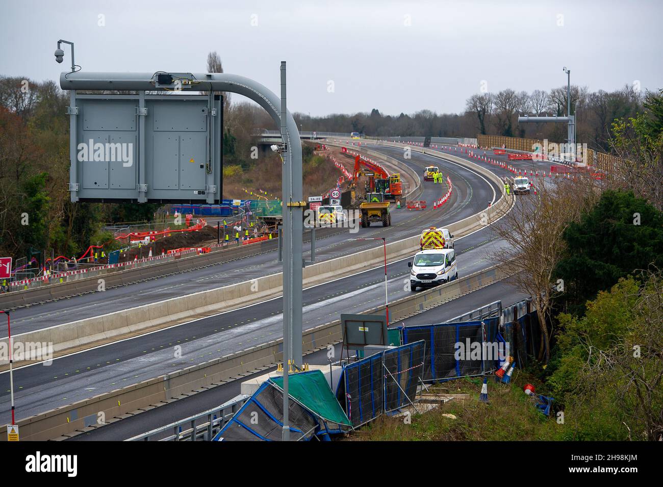 Dorney Reach, Buckinghamshire, UK. 5th December, 2021. Construction workers were demolished a wall next the pedestrian footpath adjacent to the M4 today causing noise and dust for villagers in Dorney Reach. The M4 is closed again this weekend in both directions between Junction 6 for Slough and Junction 8/9 at Maidenhead. The M4 is being upgraded to an All Lanes Running Digital Smart Motorway which will no longer have a hard shoulder but intermittent refuge areas for break downs. 38 people have died on Smart Motorways in the past five years in the UK. A Smart Motorway upgrade on the M3 has bee Stock Photo