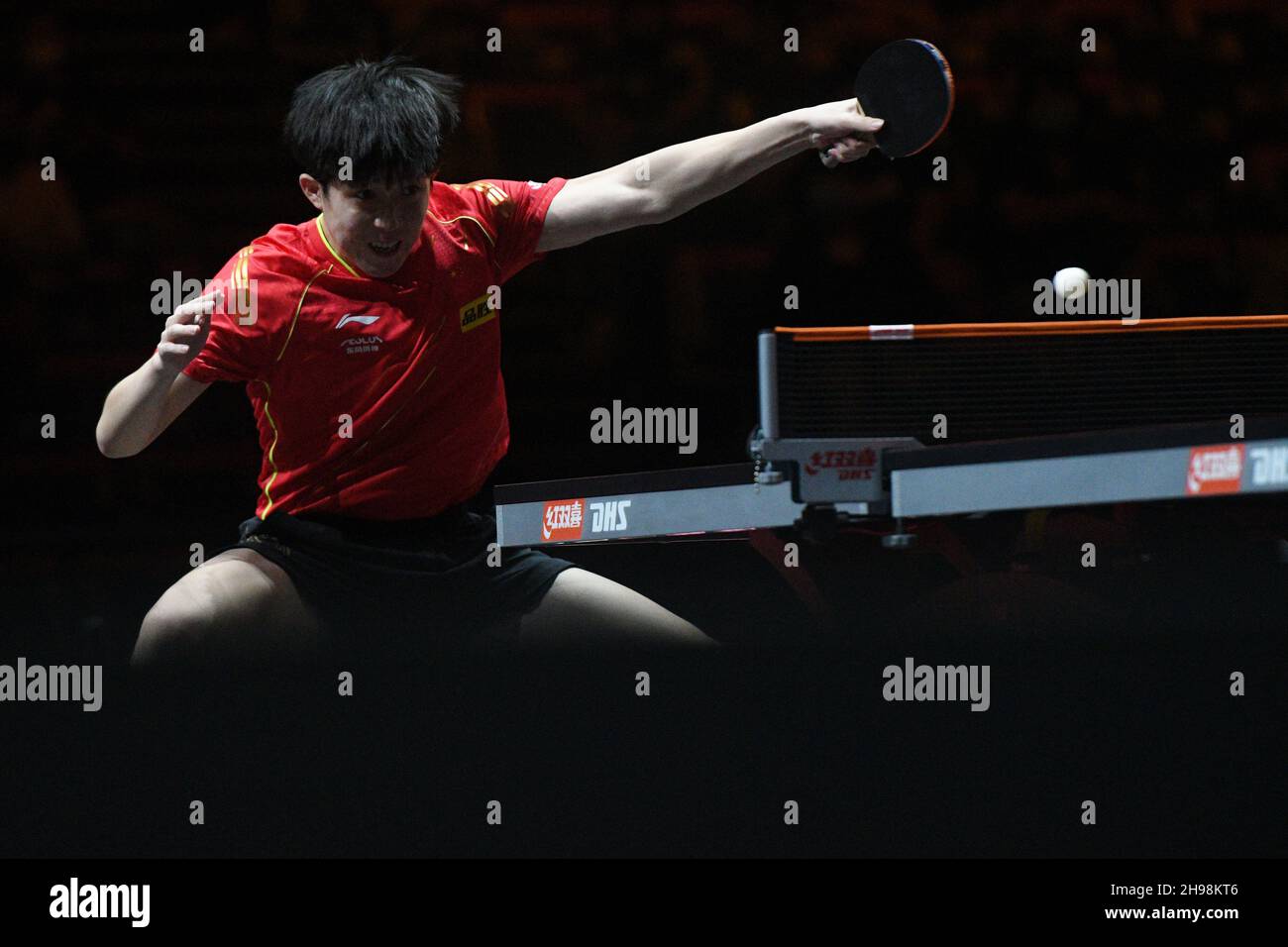 Singapore. 5th Dec, 2021. Wang Chuqin of China hits a return during the