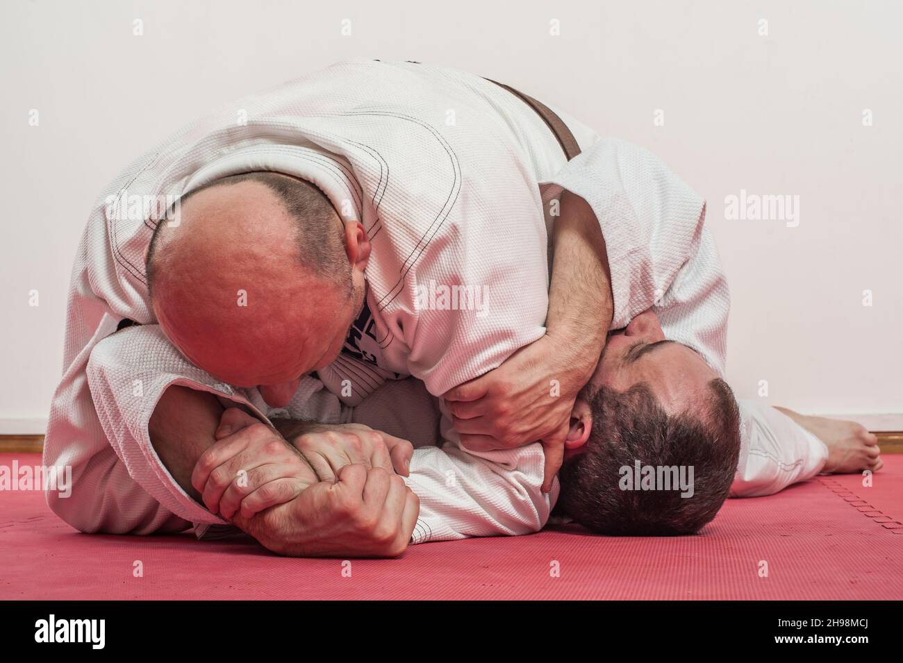 Brazilian jiujitsu training demonstration in traditional kimono. BJJ