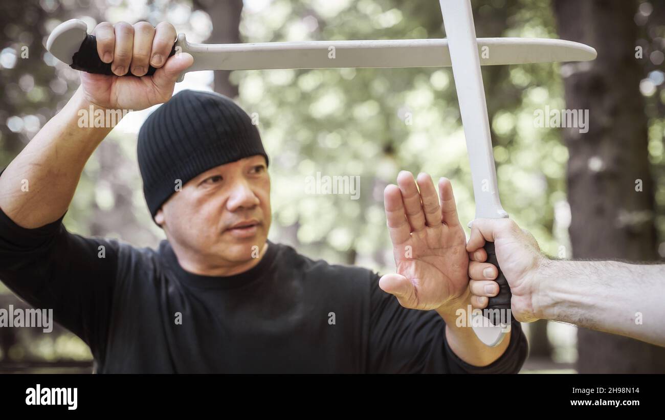 Lameco Astig Combatives instructor demonstrates single sword and long knife weapon fighting