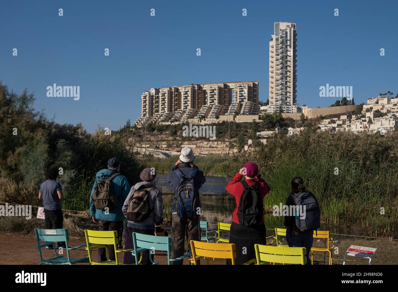 People watch a variety of wildlife in their natural behavior at the Gazelle Valley described as Israel’s first urban nature reserve named for a herd of gazelles of the subspecies Gazella that live in this area located in the heart of Jerusalem, Israel Stock Photo