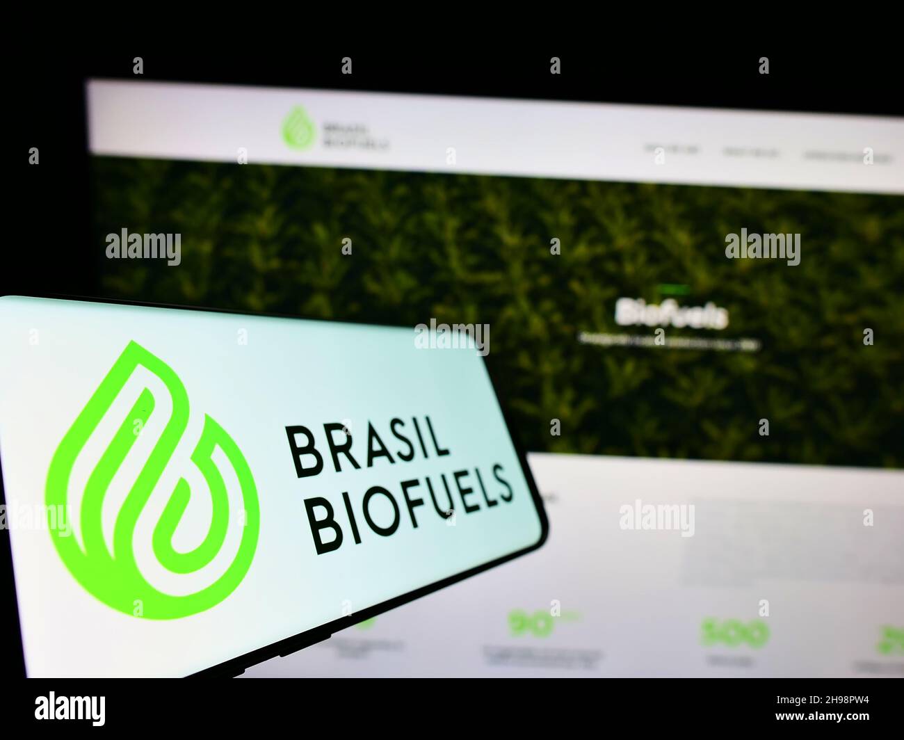 Smartphone with logo of company BBF Brasil Bio Fuels S.A. (BioFuels) on screen in front of website. Focus on center-left of phone display. Stock Photo