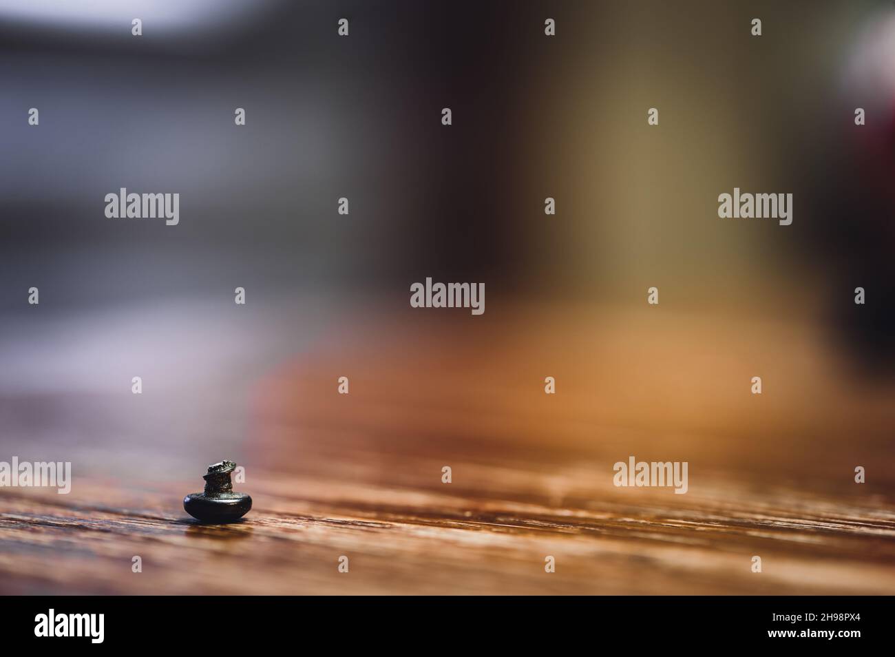 bolt head turned over to show sheared threading after stress failure