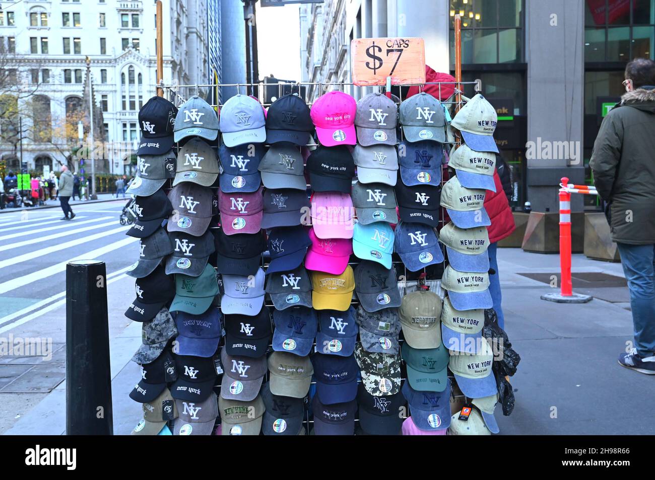 A street display of baseball hats for tourists in Mangattan, New York City, NY, USA. Stock Photo