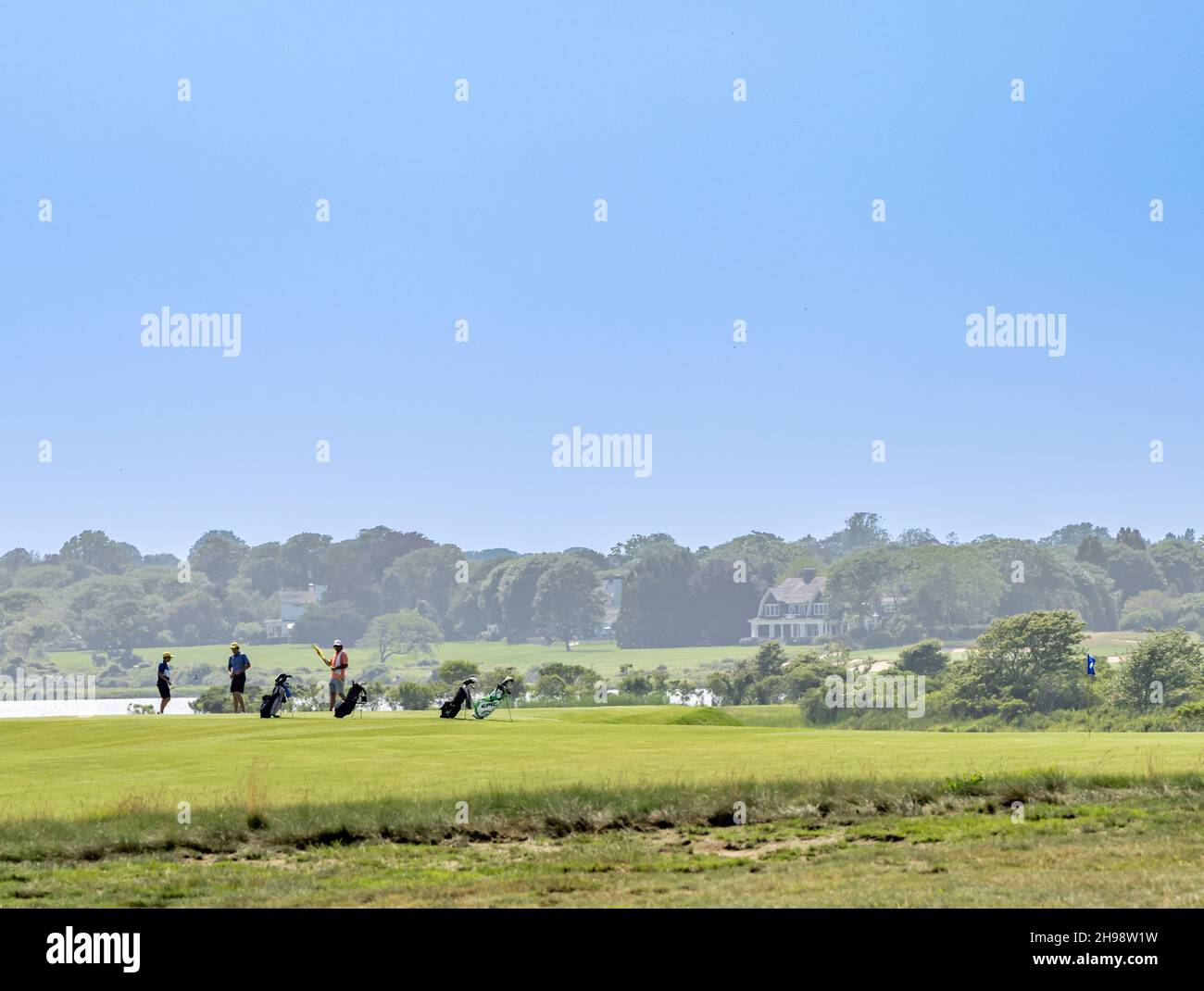 Young men playing gold at The Maidstone Club, East Hampton, NY Stock Photo