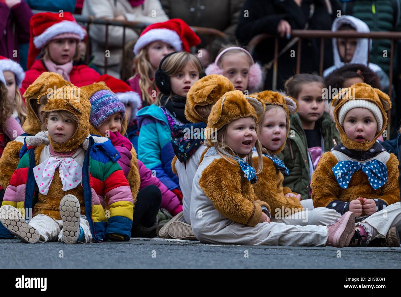 Dunbar East Lothian Scotland UK 5th December 2021. Dunbar Christmas Lights Switch On event takes place today. First up are young children from local dance group. Pictured young children watch the perf...