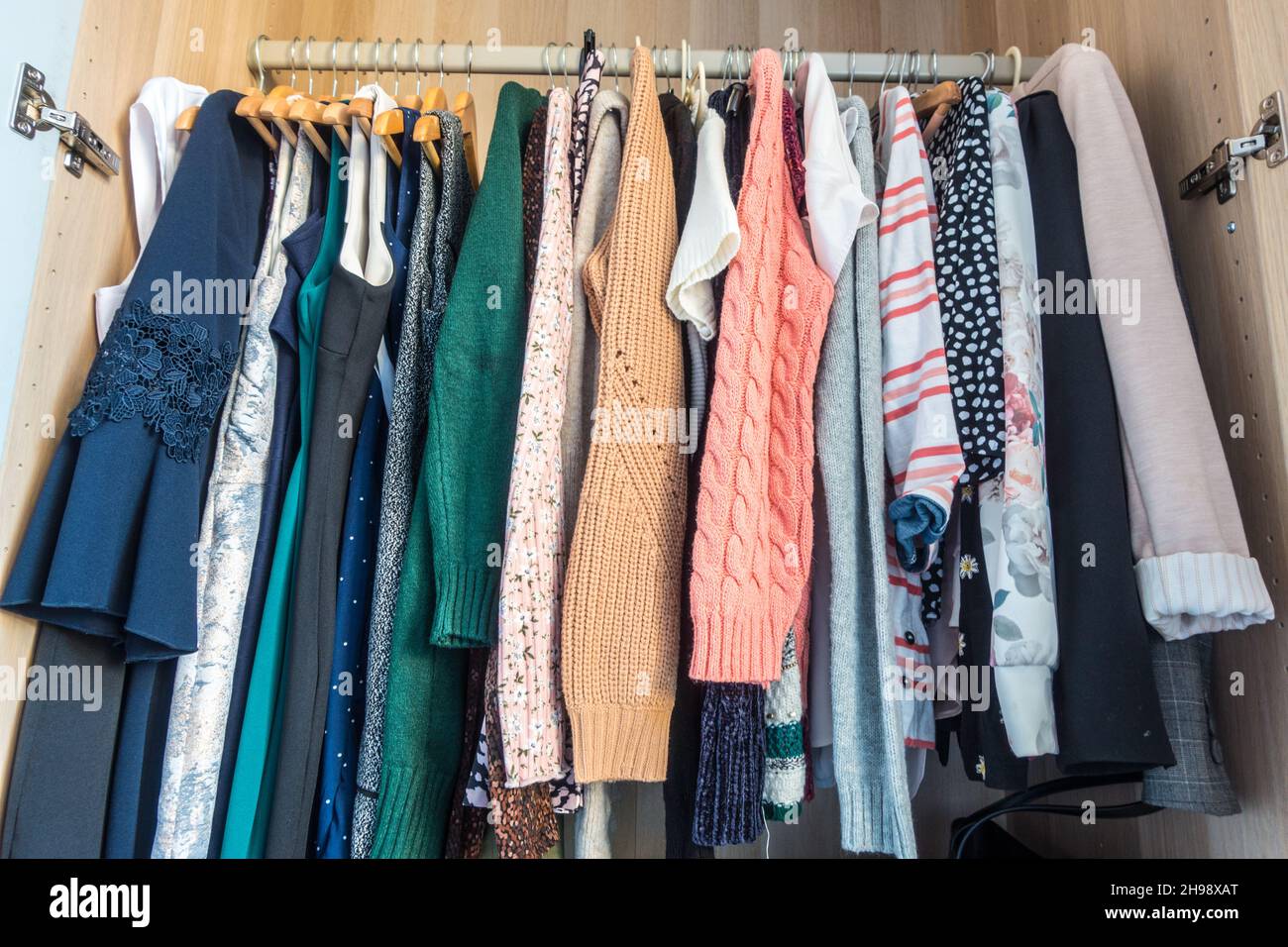 Wardrobe with Women clothes on hanger Stock Photo