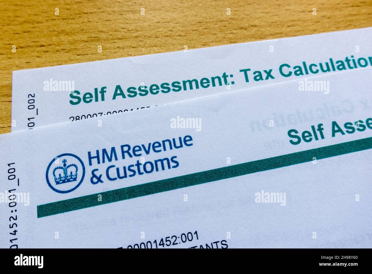 HMRC Letter for Self Assessment printed on color paper on a table Stock Photo