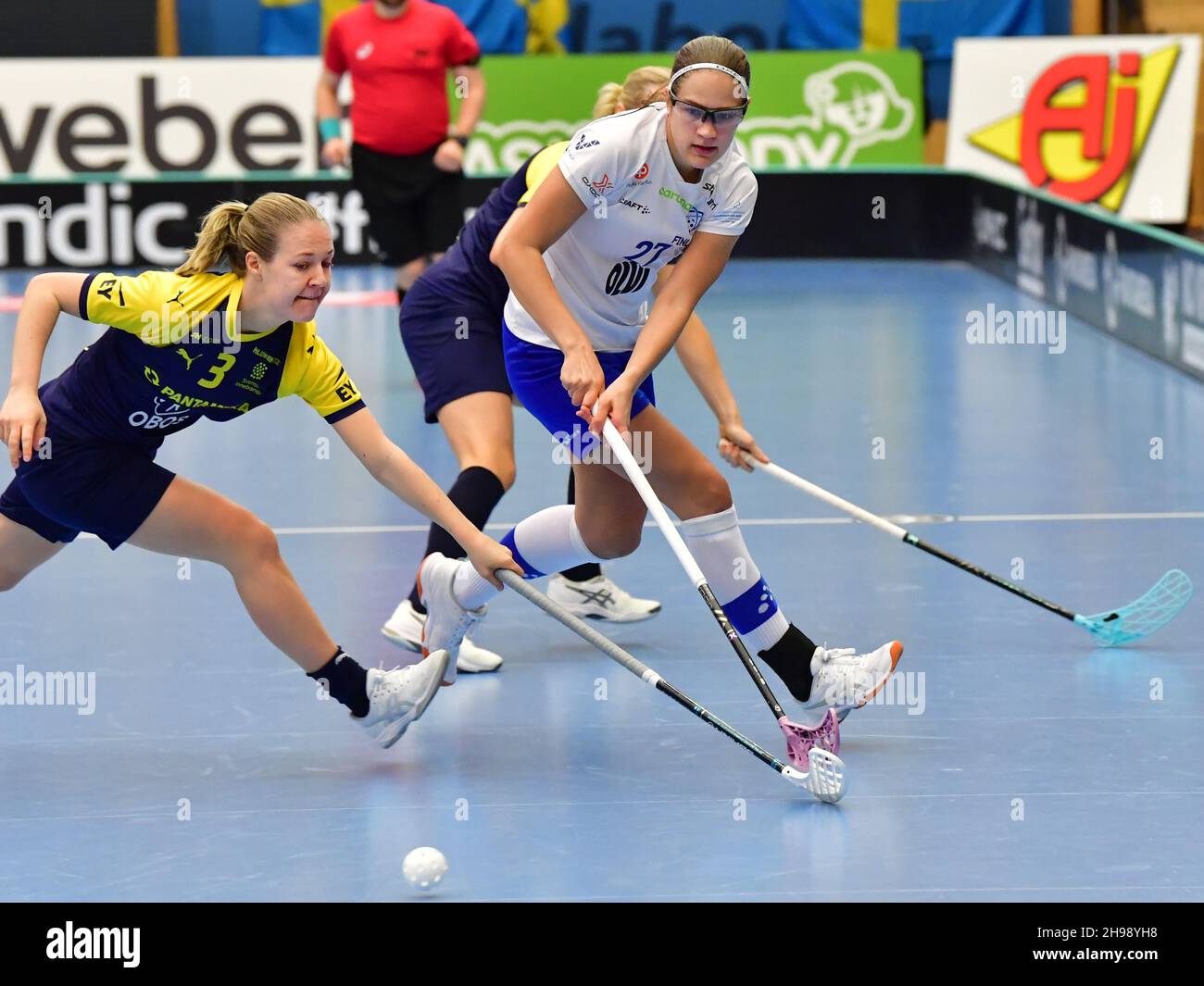 Sweden's  Amanda Delgado Johansson and Finland's Oona Kauppi during the final between Finland and Sweden at the Women's World floorball Championships Stock Photo