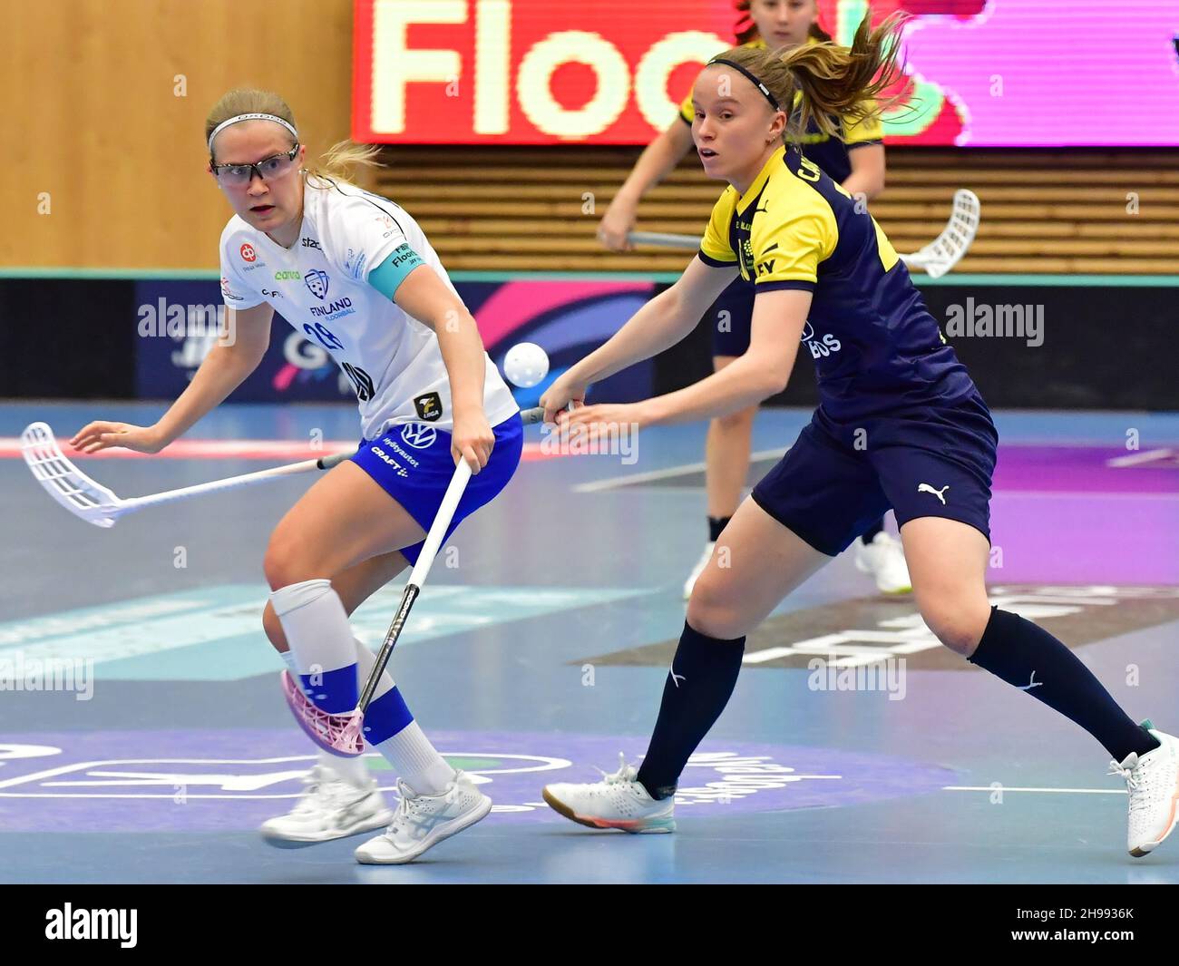 Finland's Veera Kauppi and Sweden's Lisa Carlsson during the final between Finland and Sweden at the Women's World floorball Championships at IFU Aren Stock Photo