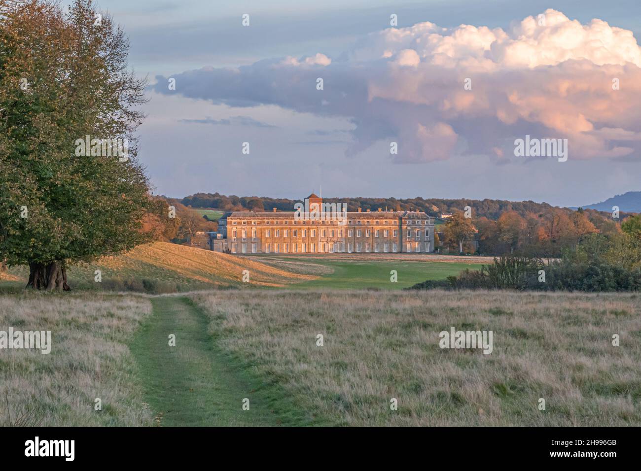 Petworth Park and House in the late autumn light with a stunning sky above Stock Photo