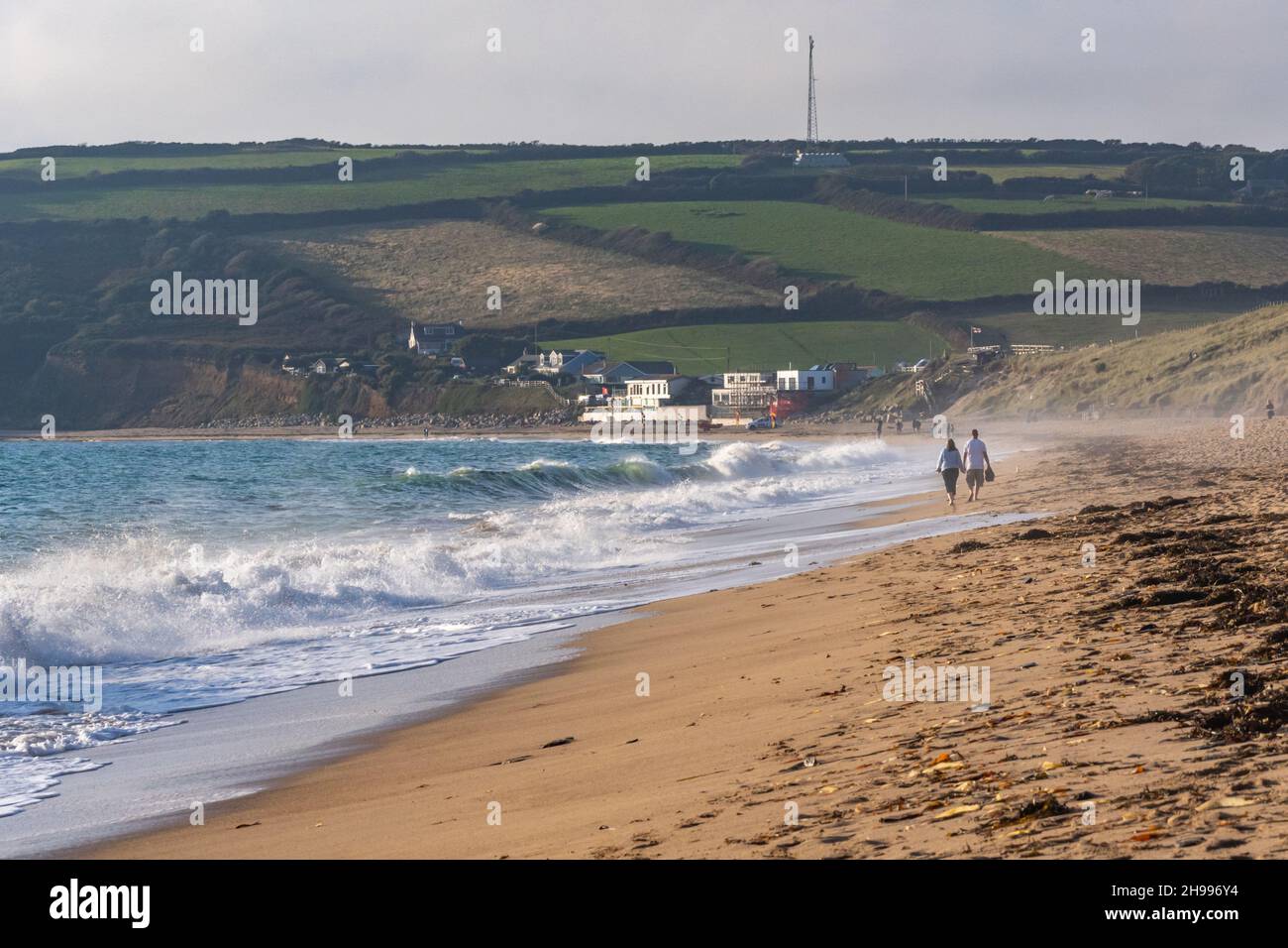 Walkers on the ever popular Praa Sands beach in Cornwall Stock Photo