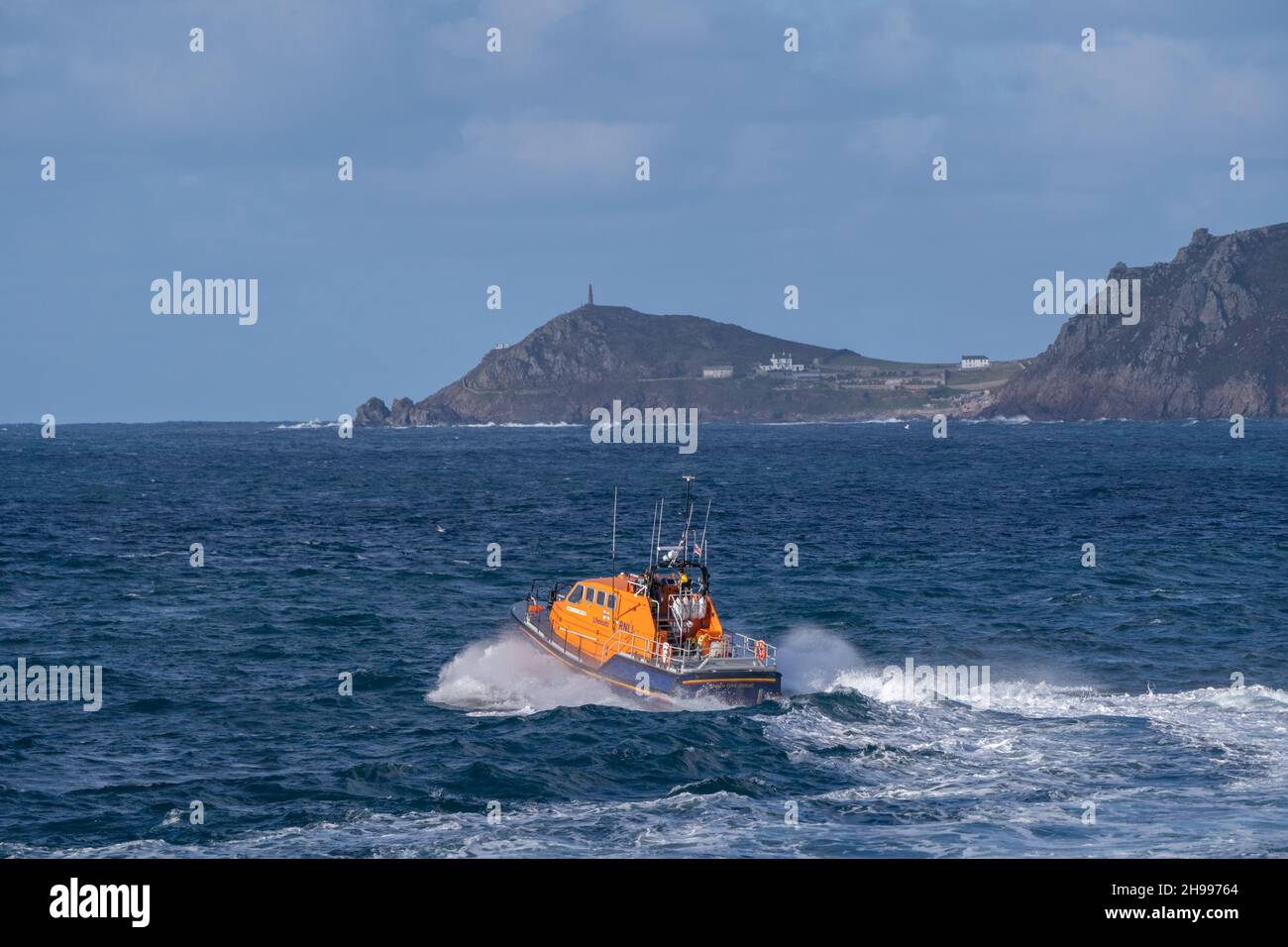 The Tamar class City of London III lifeboat being launched from it's home station of Sennen Cove Lifeboat station with Cape Cornwall in the distance. Stock Photo