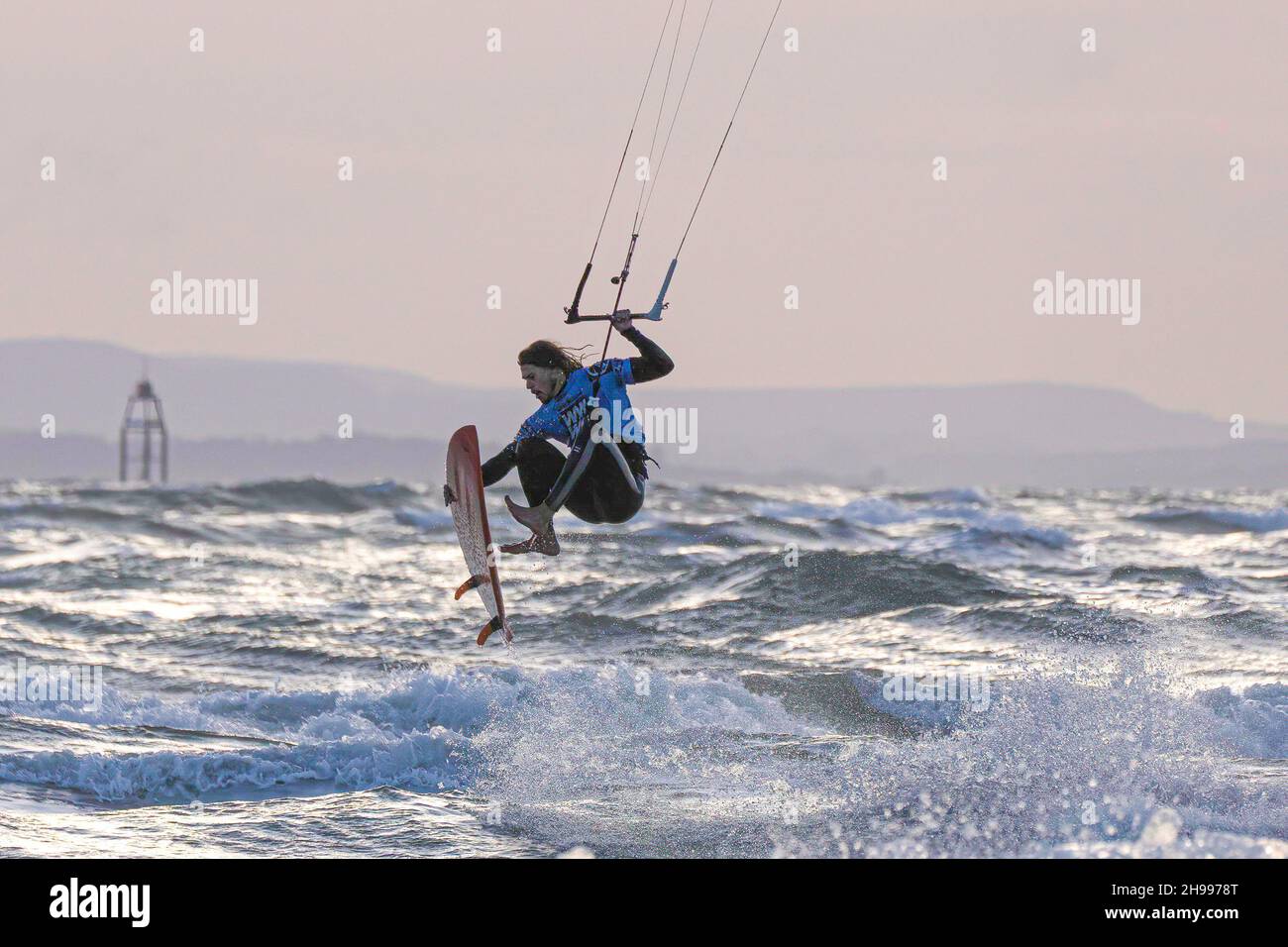 Kite surfing from the beautiful West Wittering beach near the ancient Cathedral city of Chichester in West Sussex Stock Photo