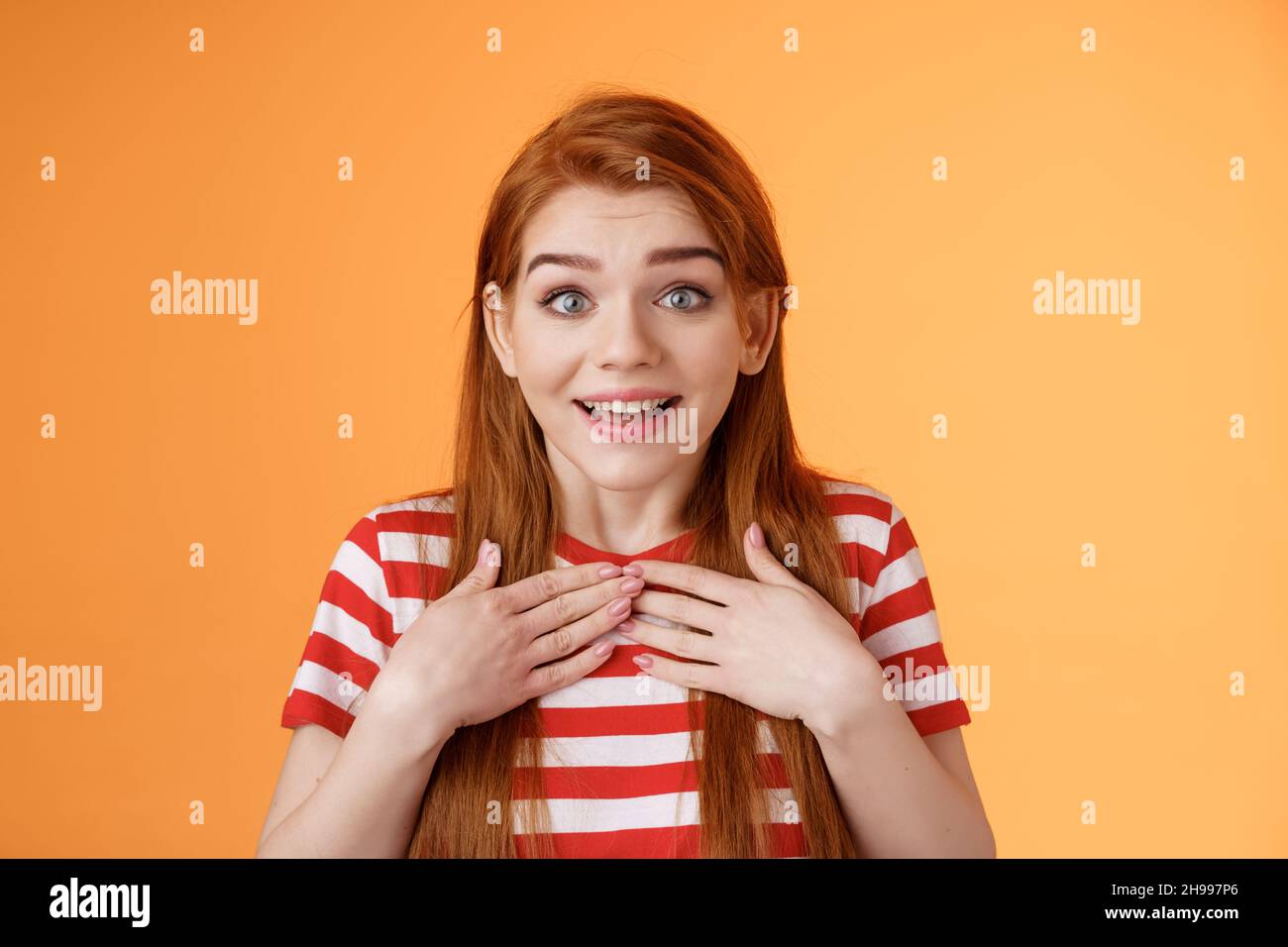 Redhead cute girl receive pleasant news. Charmed happy ginger woman ...