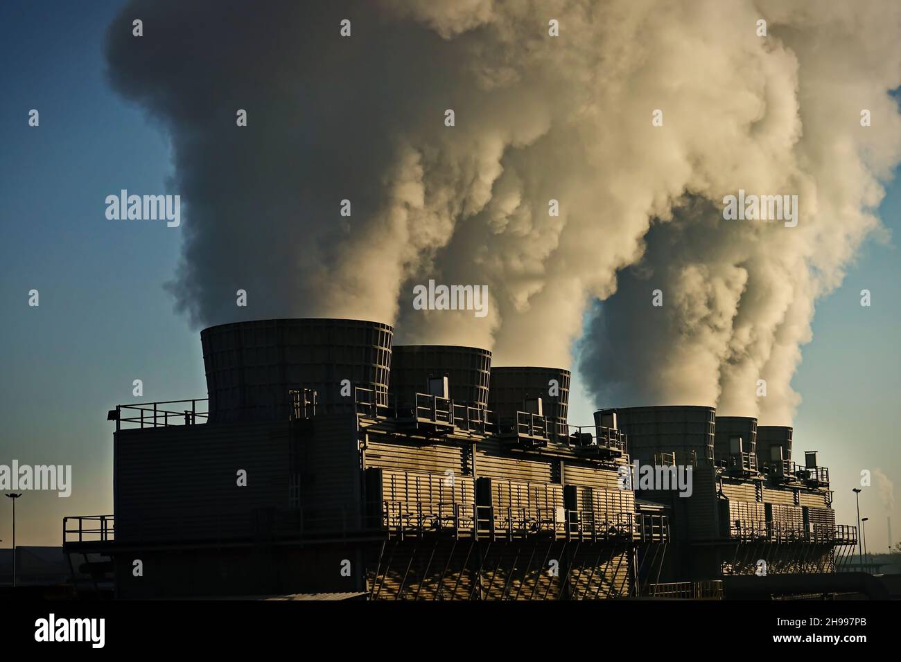 Factory chimneys with smoke emission. Industrial factory pollution, smokestack exhaust gases. factory chimney Stock Photo