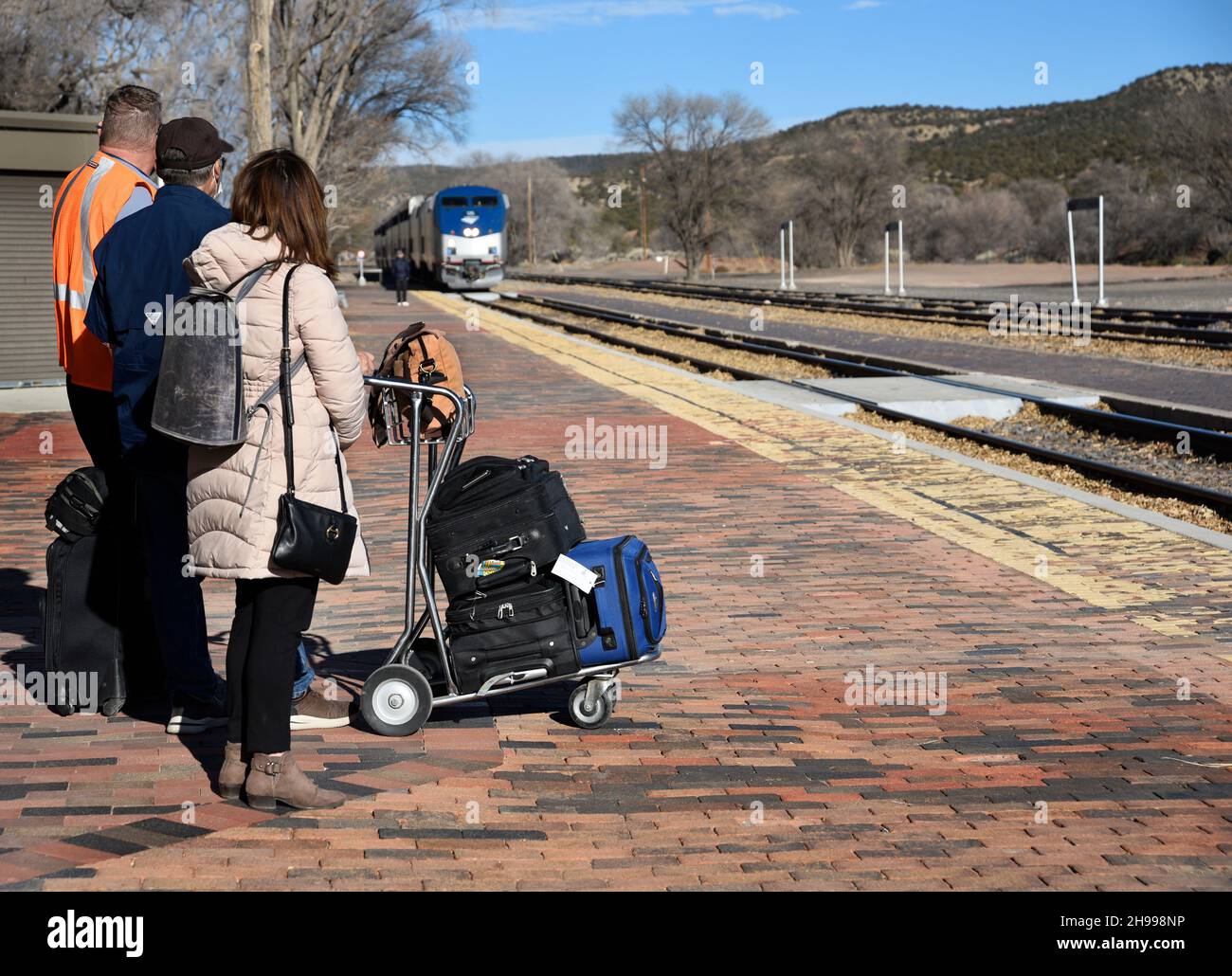 Train passengers at Lamy, New Mexico, prepare to board the Southwest Chief operated by Amtrak which operates between Chicago to Los Angeles. Stock Photo