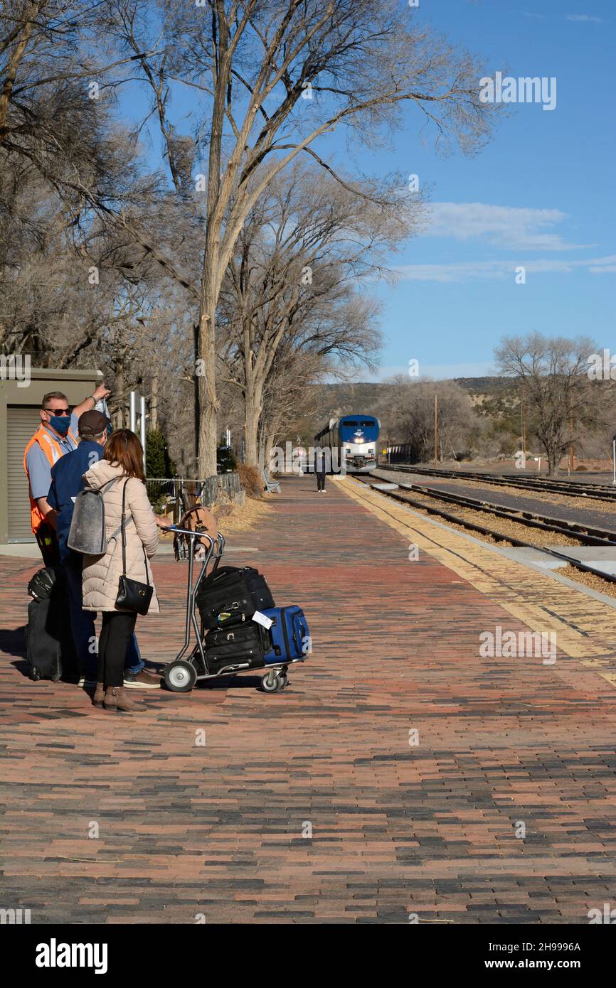 Train passengers at Lamy, New Mexico, prepare to board the Southwest Chief operated by Amtrak which operates between Chicago to Los Angeles. Stock Photo