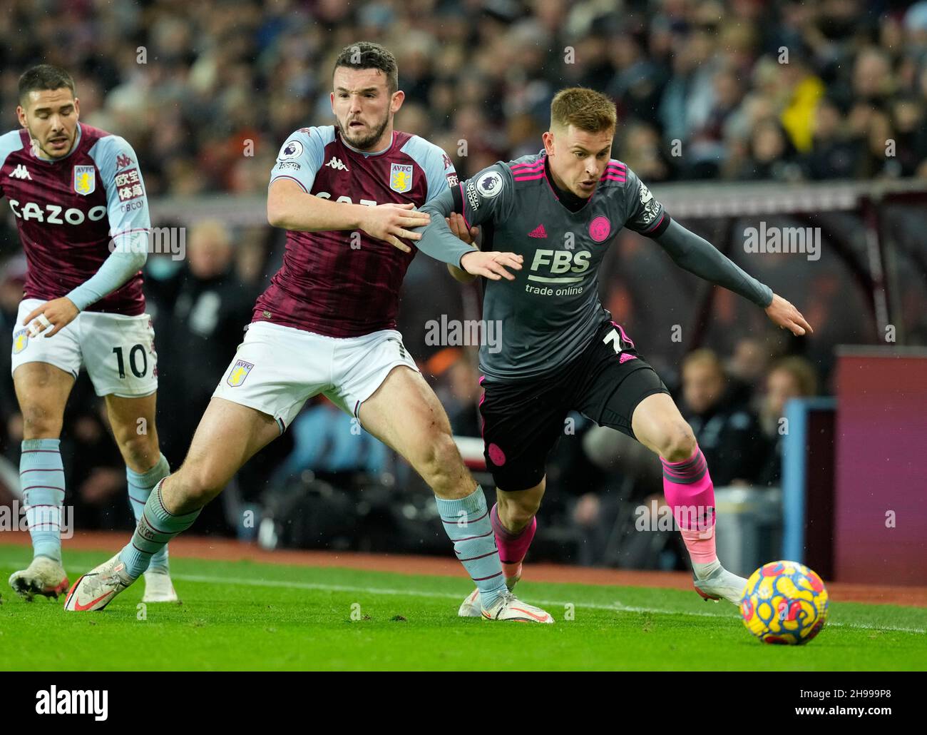 Birmingham, England, 5th December 2021. John McGinn of Aston Villa challenges Harvey Barnes of Leicester City  during the Premier League match at Villa Park, Birmingham. Picture credit should read: Andrew Yates / Sportimage Stock Photo