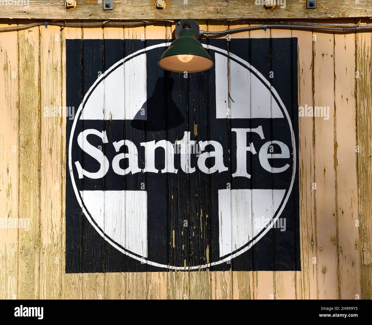 The historic logo for the Atchison, Topeka and Santa Fe Railway painted on a vintage boxcar at historic Lamy Station in Lamy, New Mexico. Stock Photo