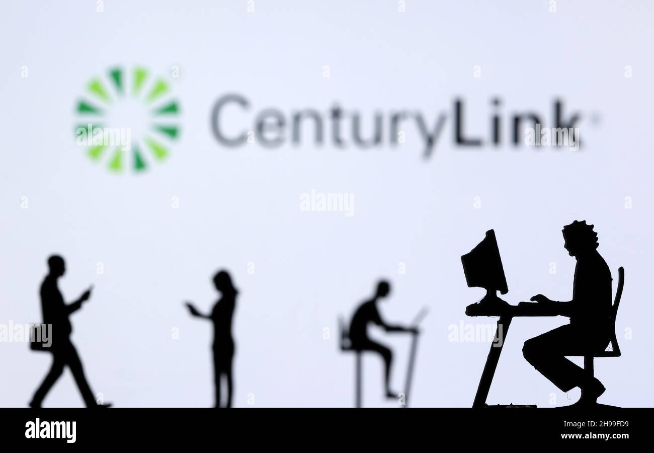 Small toy figures with laptops and smartphones are seen in front of displayed CenturyLink Internet logo, in this illustration taken December 5, 2021. REUTERS/Dado Ruvic/Illustration Stock Photo