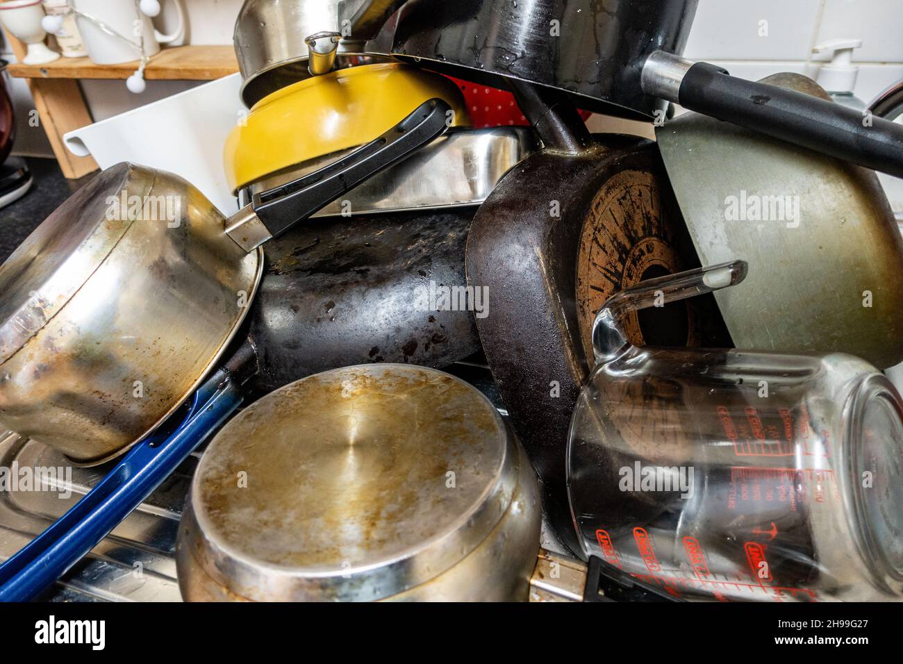 Big pile of upside down cooking pots and pans Stock Photo Alamy