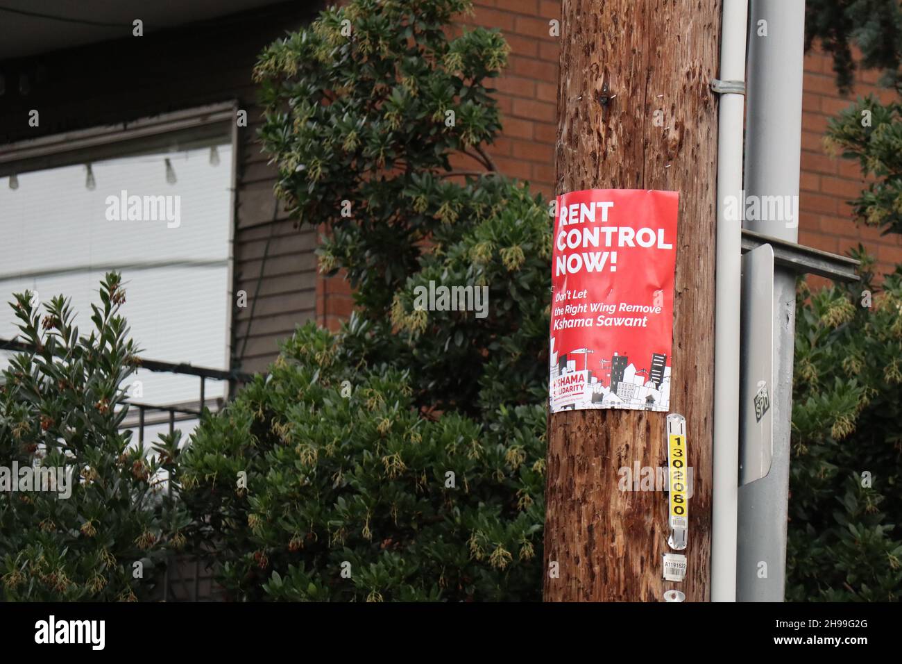 A rent control sign is picture on a telephone pole in Seattle. Stock Photo