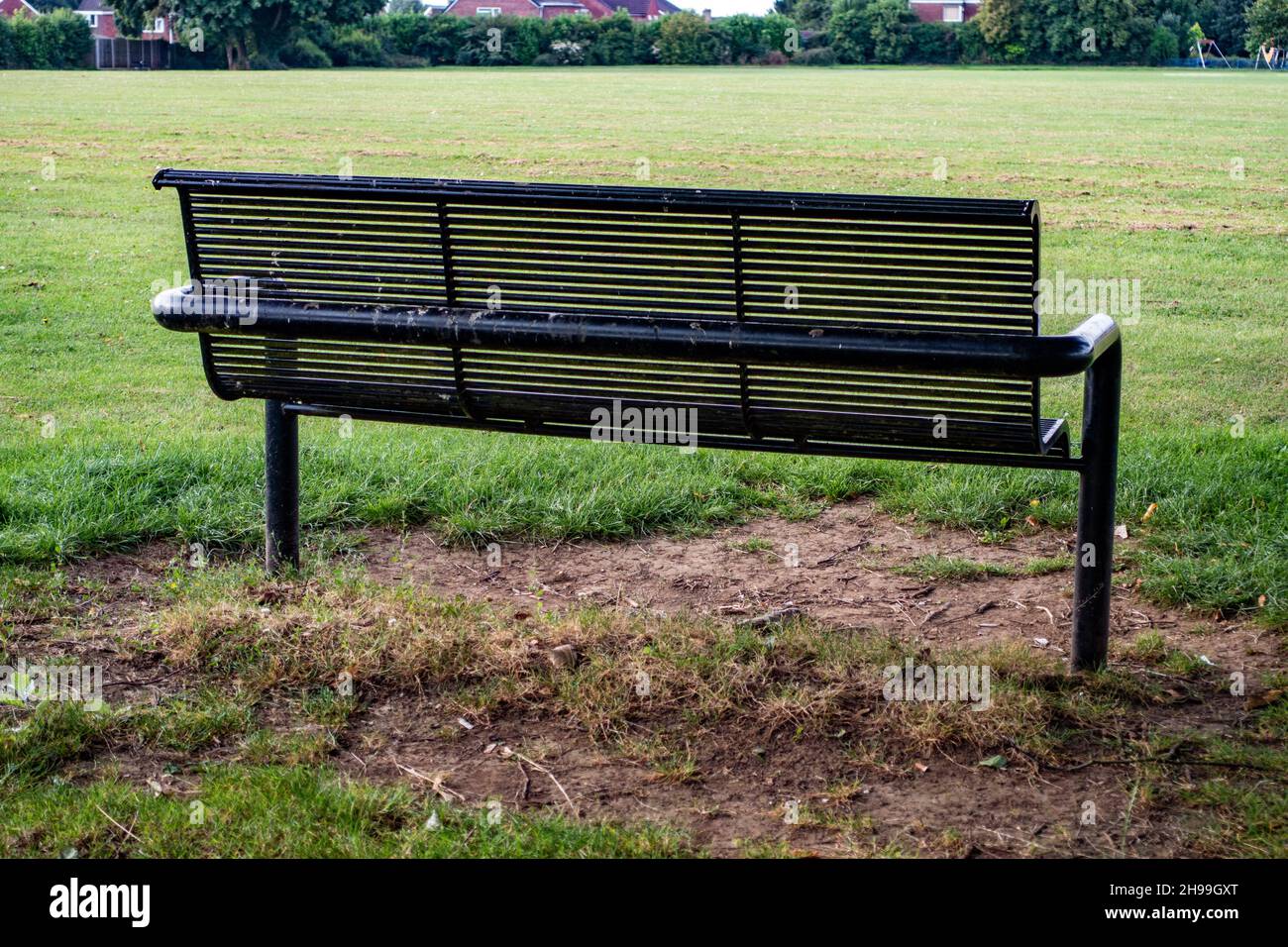 Metal Park bench from the rear in Greenlands Park, Dinnington, South Yorkshire Stock Photo