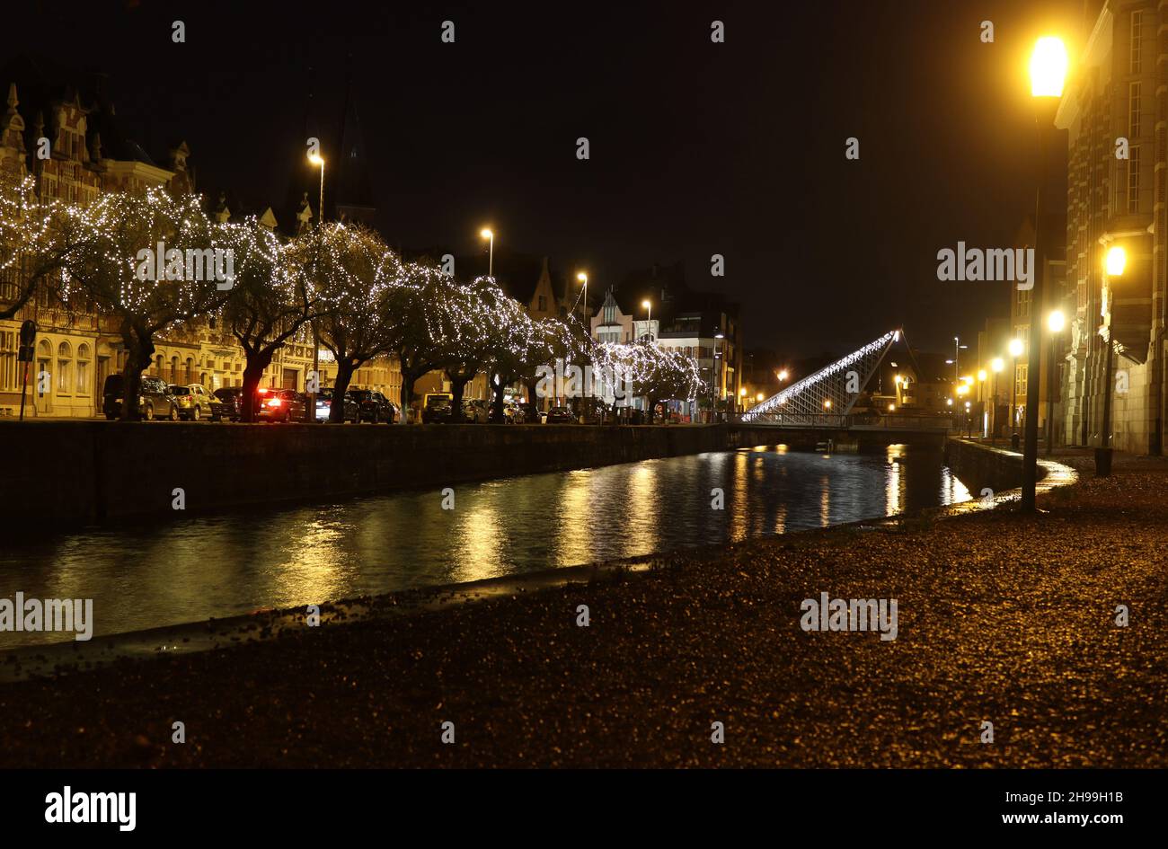 DENDERMONDE, BELGIUM, 4 DECEMBER 2021: Night time view of Dendermonde Waterfront and Oud Dender River, Belgium. Dendermonde is a large town in East Fl Stock Photo