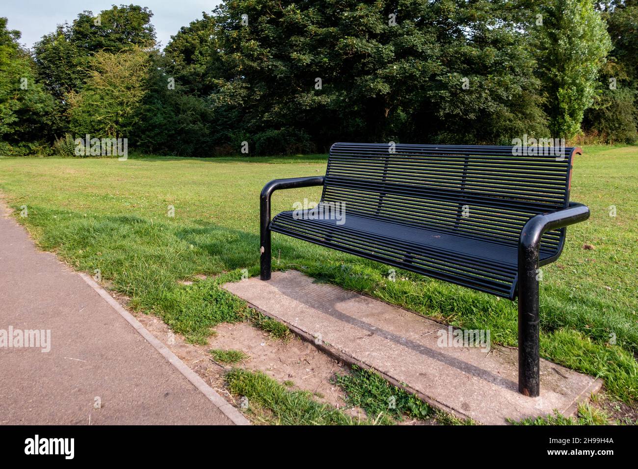 Metal Park bench in Greenlands Park, Dinnington, South Yorkshire Stock Photo