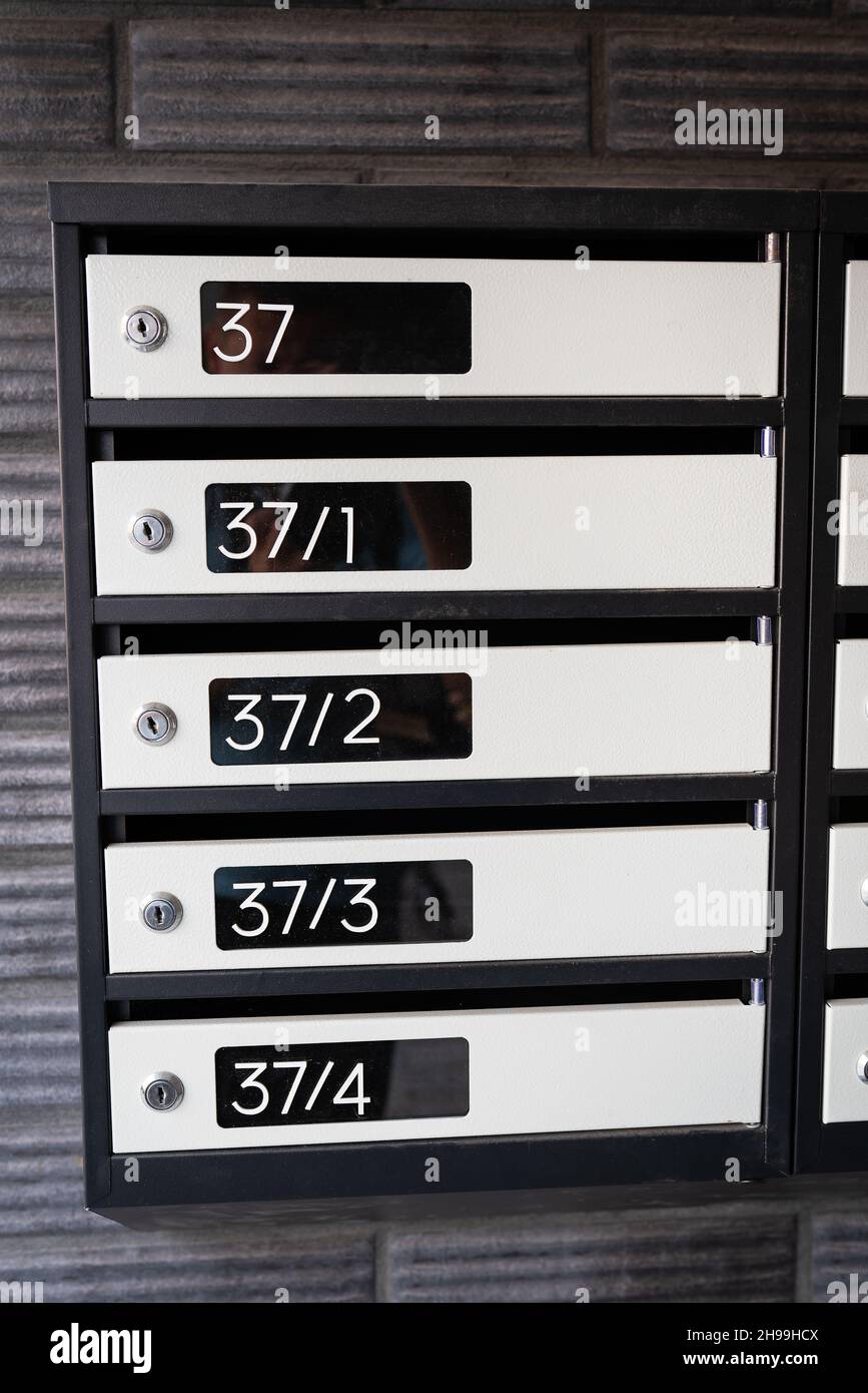Metal mailboxes in a modern apartment building Stock Photo Alamy