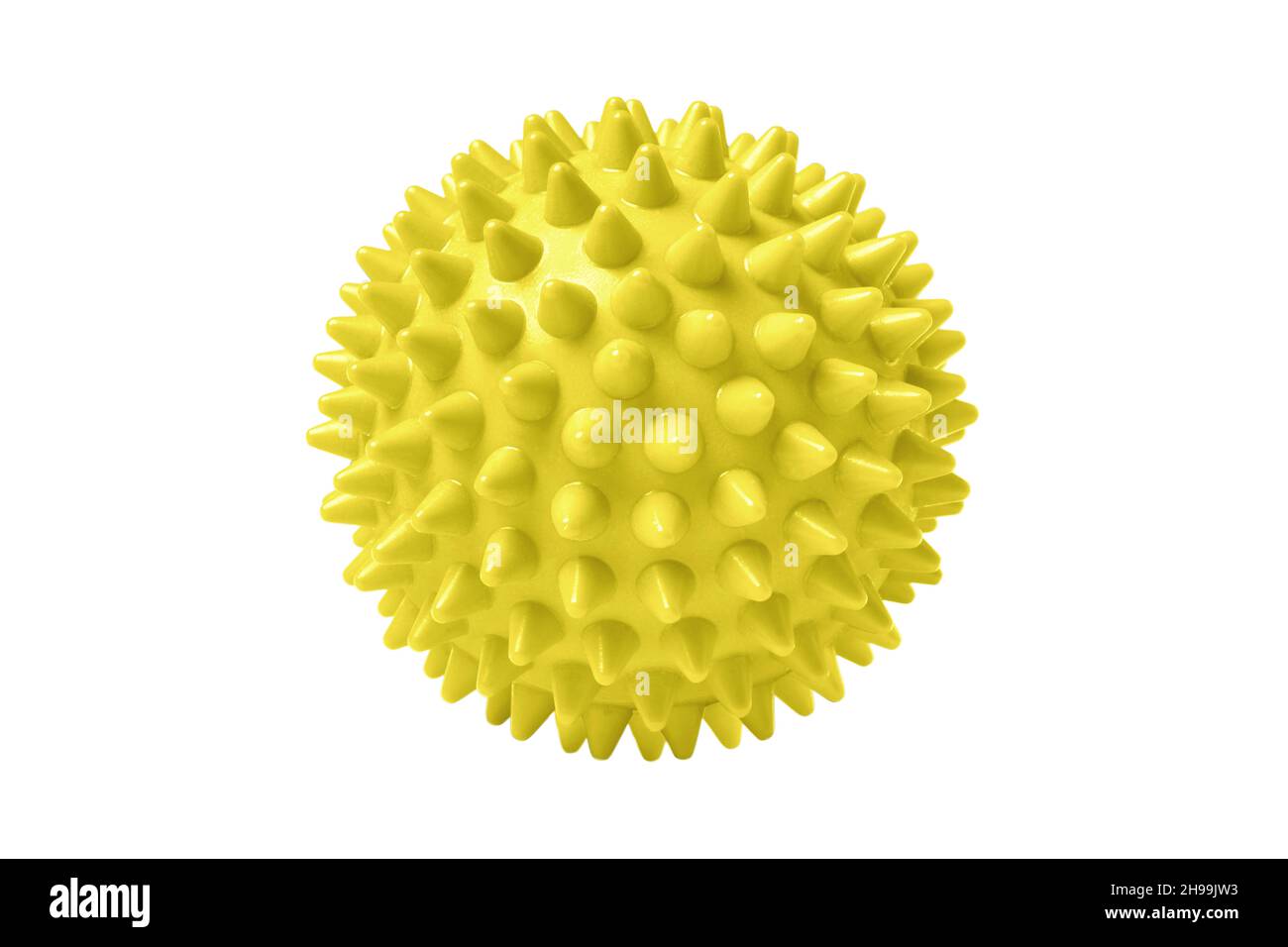 Yellow plastic spiny massage ball isolated on white. Concept of physiotherapy or fitness. Closeup of a colorful rubber ball for dog teeth on a white Stock Photo